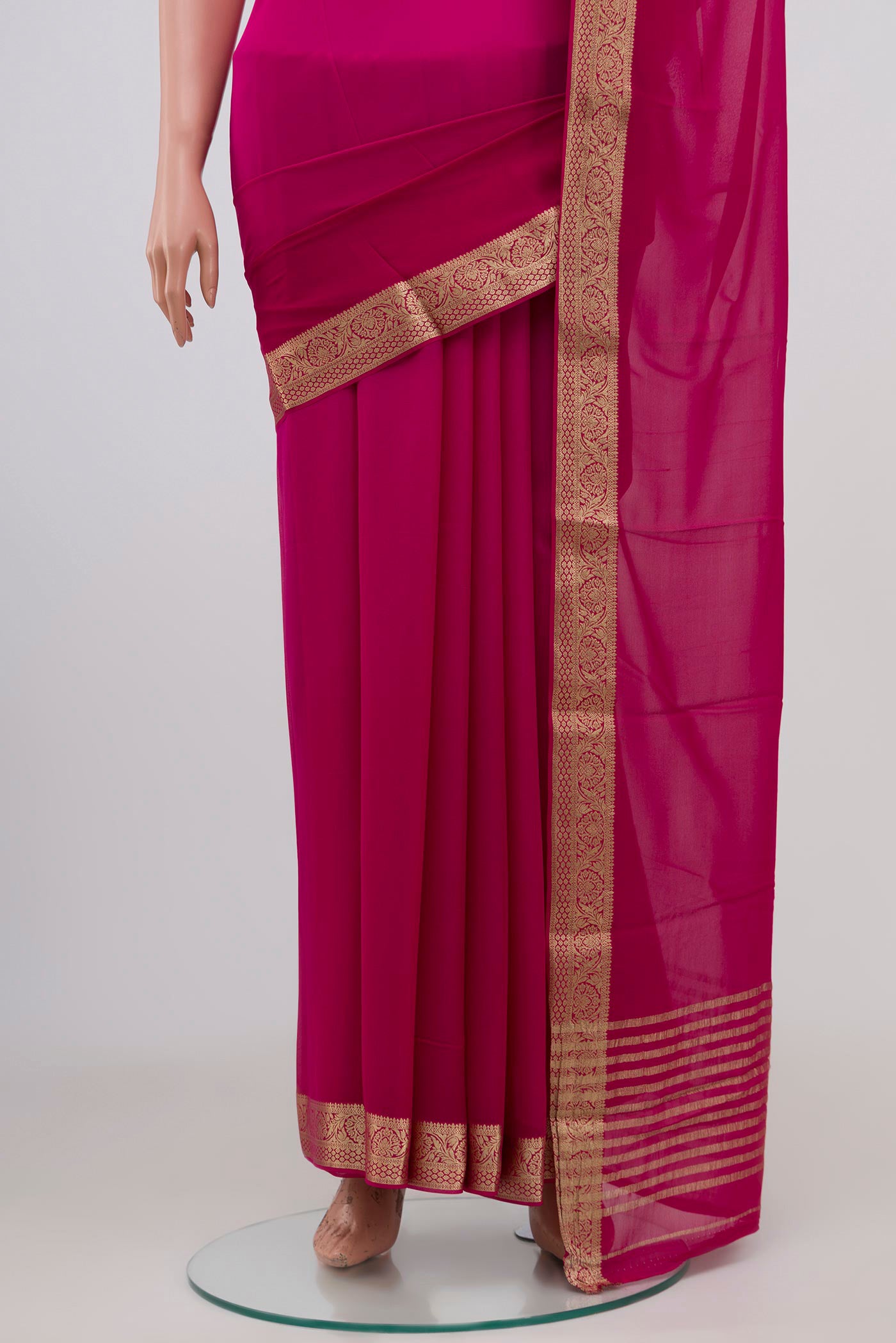 Pleats and pallu of Pink Chiffon Saree with Plain Body and Zari Border. 