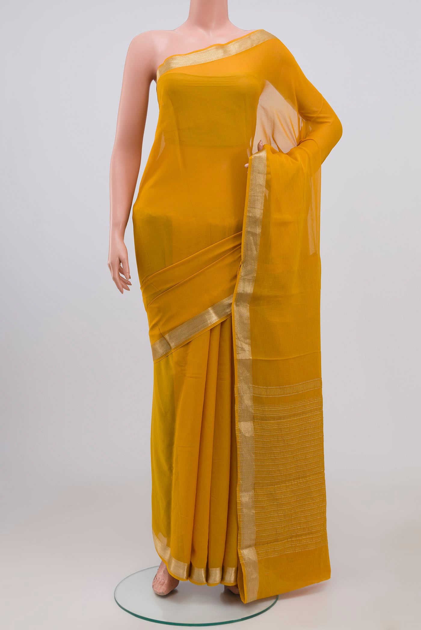 Yellow Chiffon Saree with Plain Body and Zari Border.  displayed on a mannequin