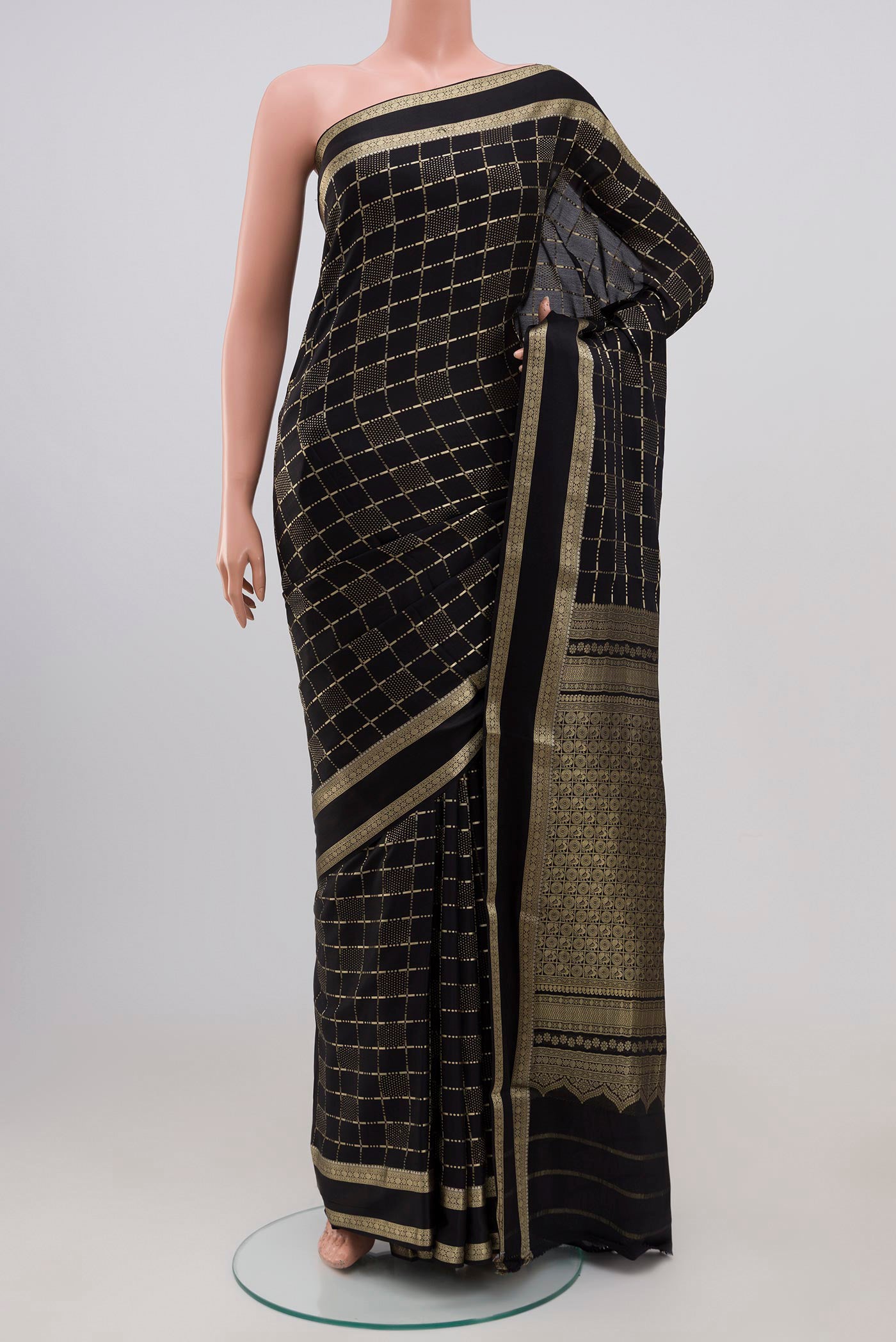 Black Mysore Silk Saree with Checked design on the body and Zari Border.  displayed on a mannequin