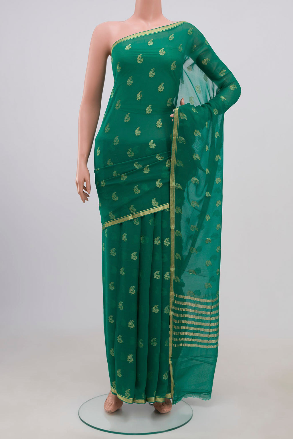 Green Chiffon Saree with Zari Brocade on the body and Zari Border.  displayed on a mannequin