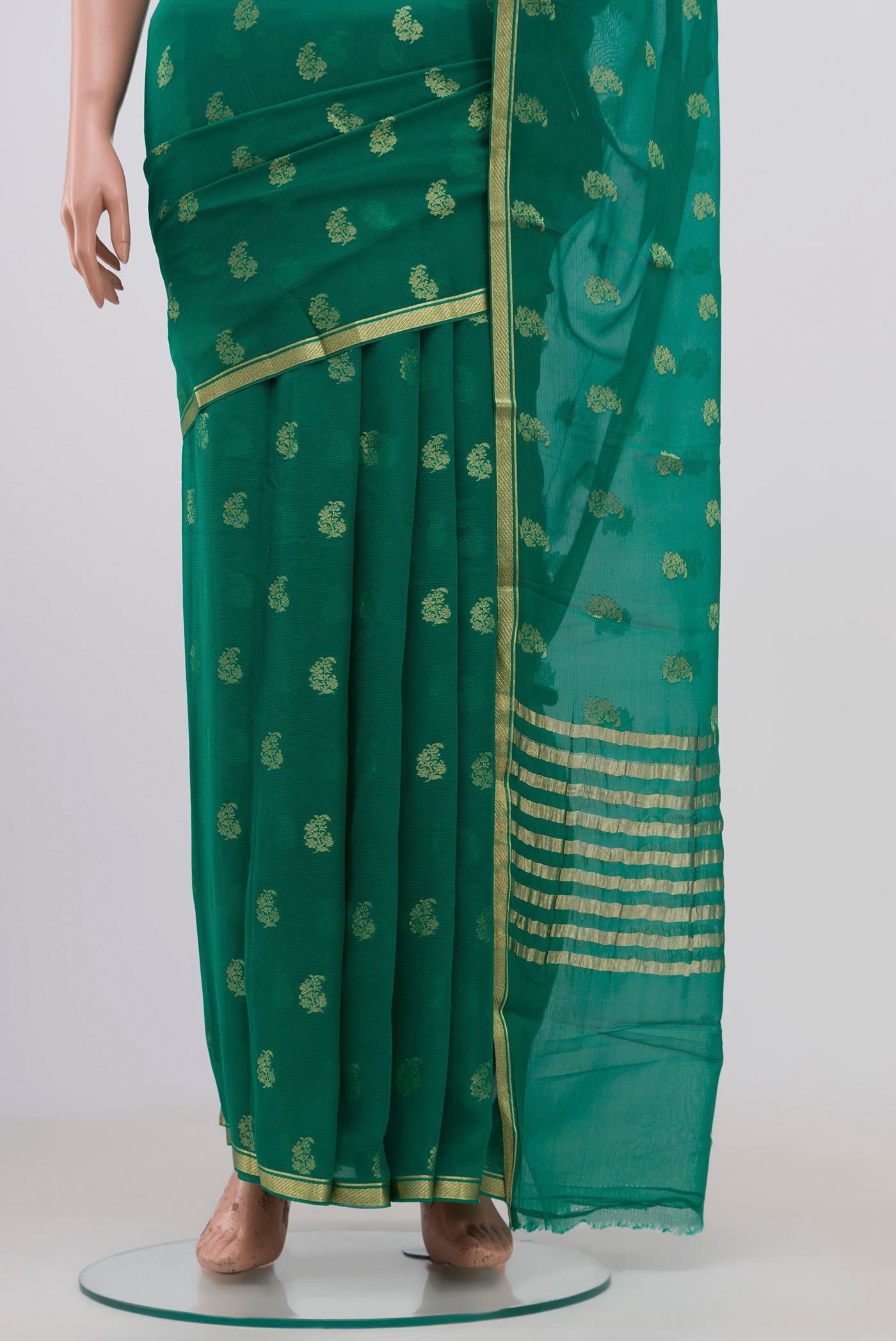Pleats and pallu of Green Chiffon Saree with Zari Brocade on the body and Zari Border. 