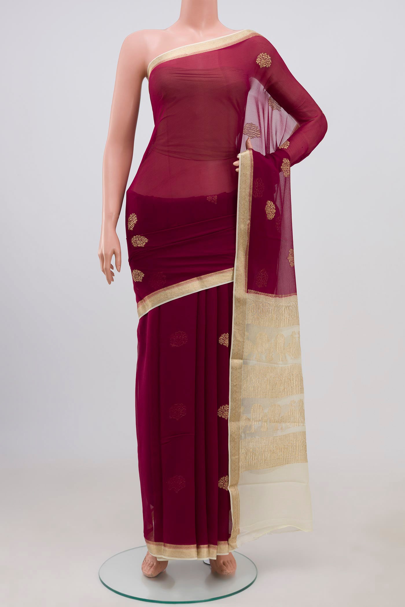 Purple Chiffon Saree with Zari Butta on the body and Zari Border.  displayed on a mannequin