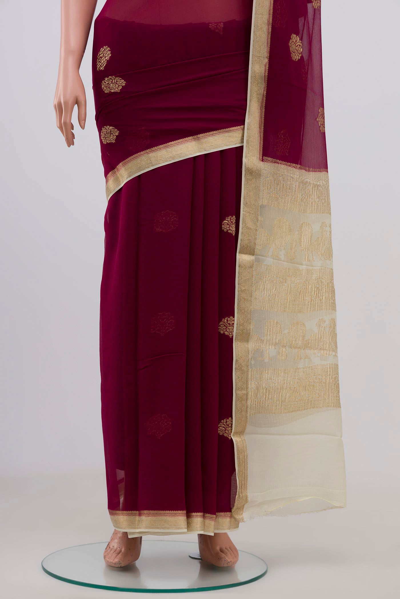 Pleats and pallu of Purple Chiffon Saree with Zari Butta on the body and Zari Border. 