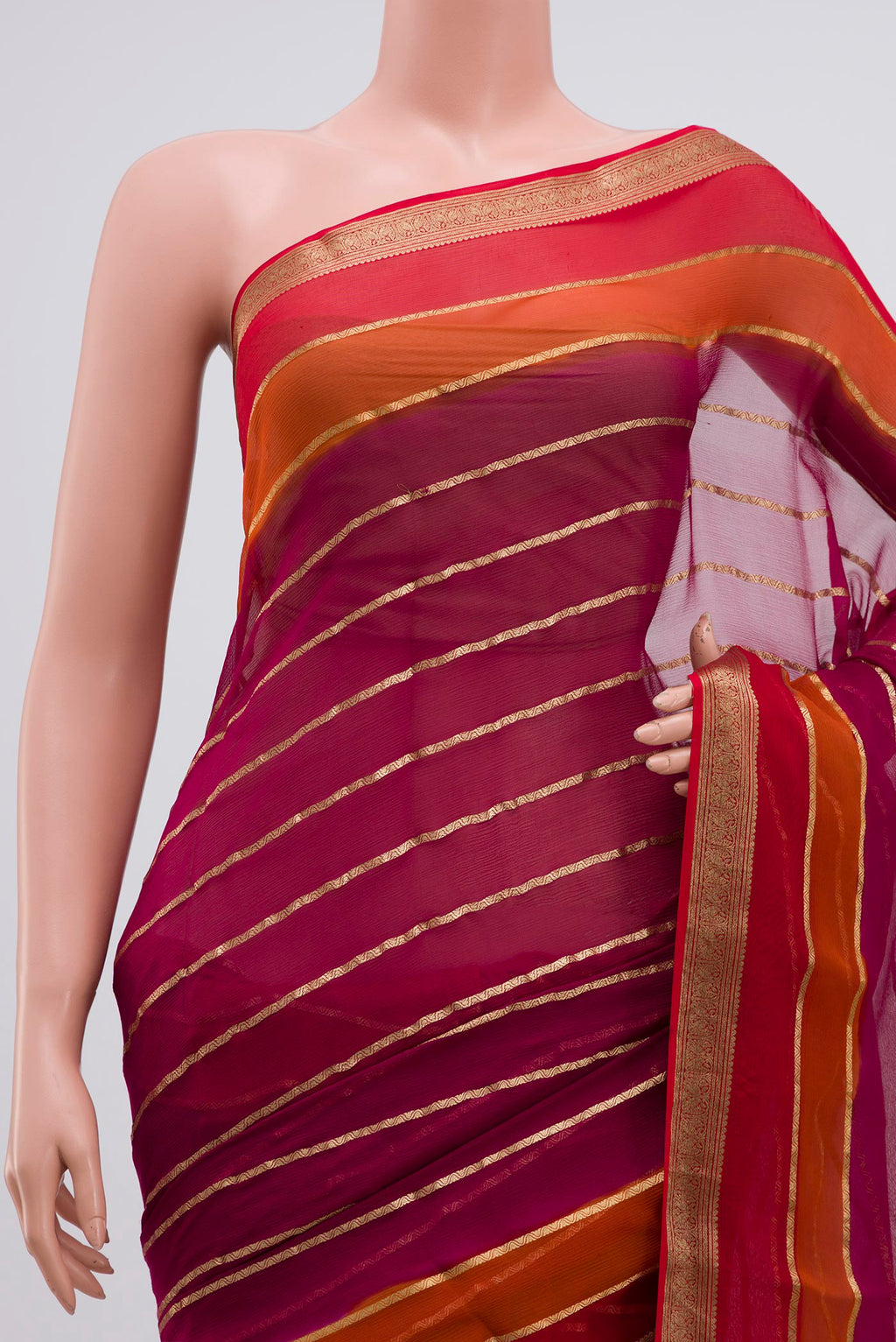 Border image of Magenta Chiffon Saree with Veldhari on the body and Zari Border. 
