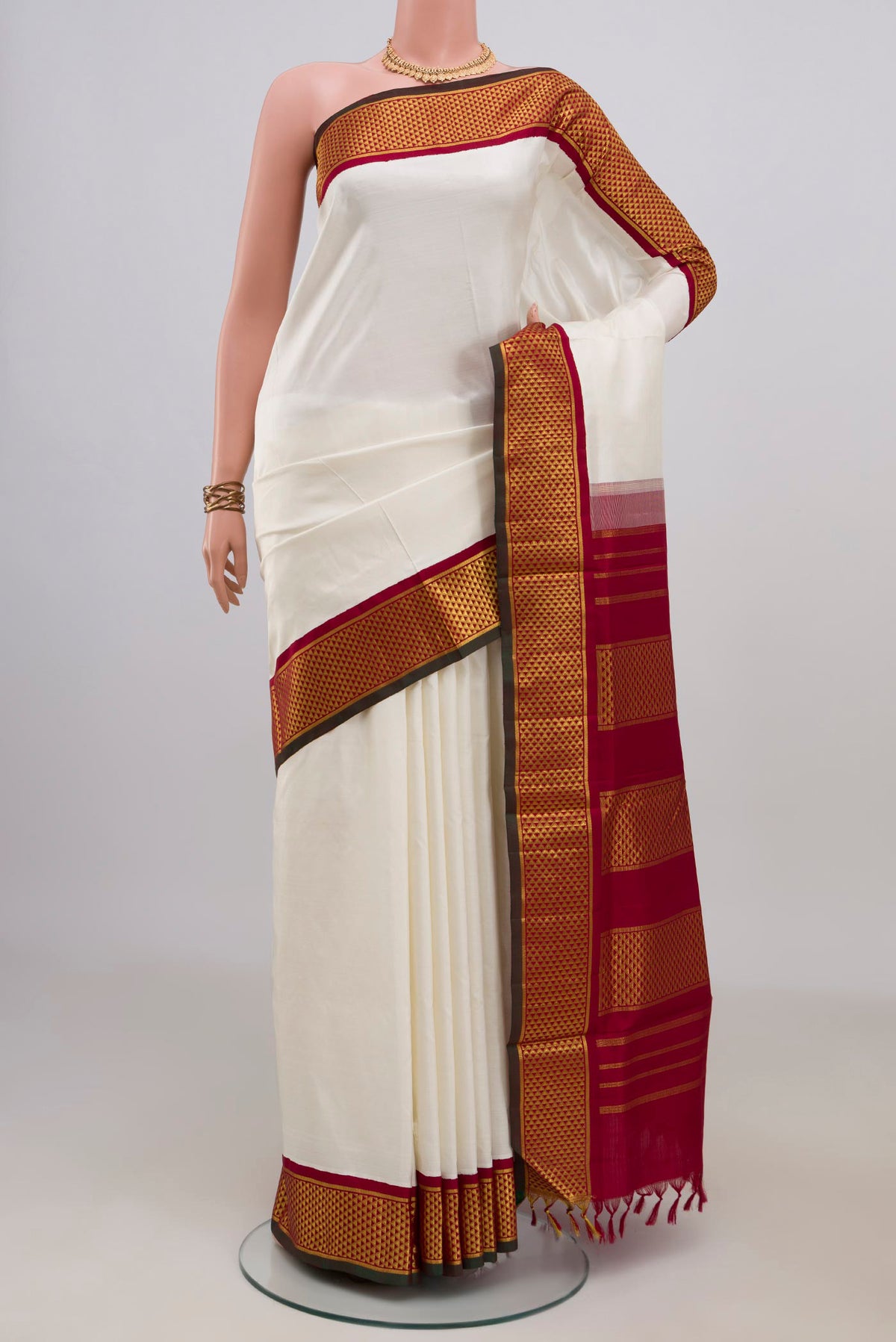 Pure Silk White Kanchipuram Nine Yards Saree with Plain Body and Zari Border.  displayed on a mannequin