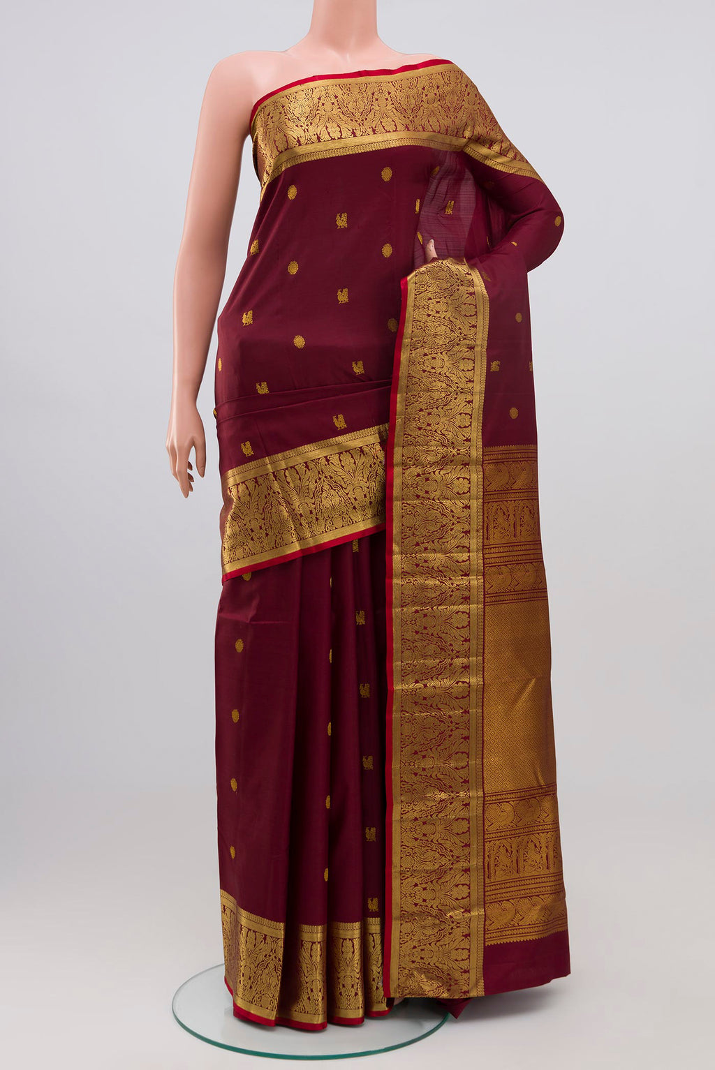 Coffee Brown Kanjivaram Silk Saree with Zari Butta on the body and Zari Border.  displayed on a mannequin