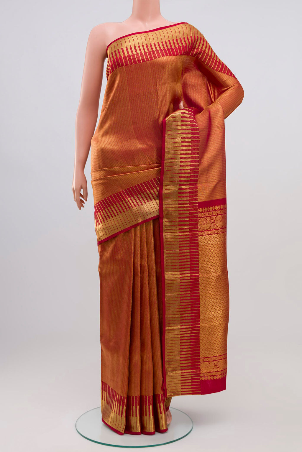 Maroon Kanchipuram Silk Saree with Zari Brocade on the body and Zari Border.  displayed on a mannequin