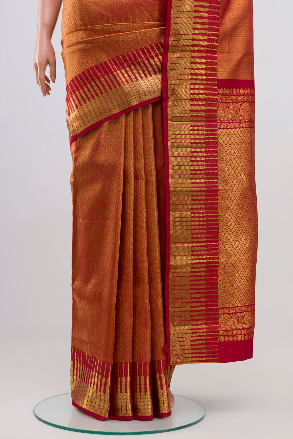 Pleats and pallu of Maroon Kanchipuram Silk Saree with Zari Brocade on the body and Zari Border. 
