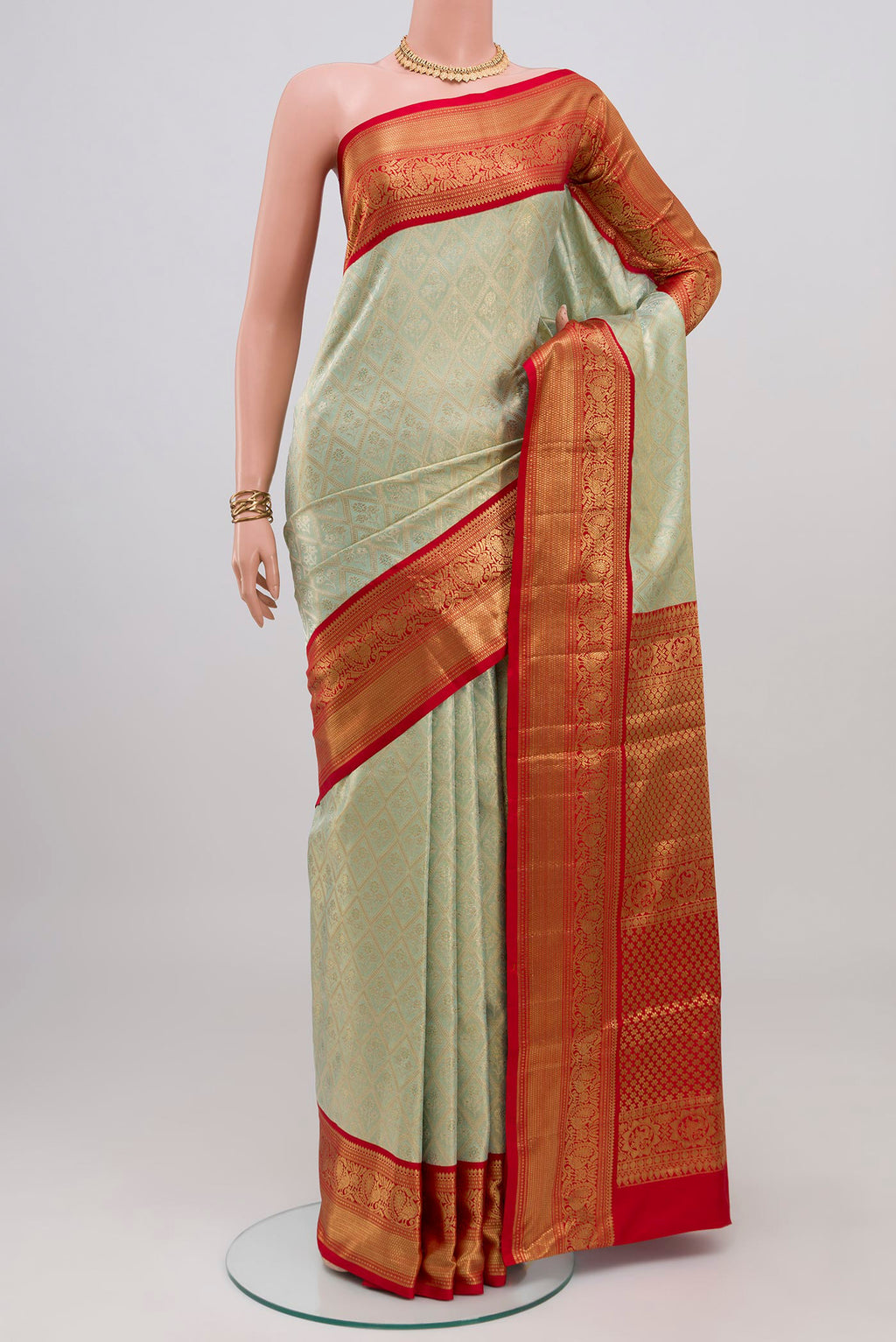 Light Blue Kanjivaram Tissue Silk Saree with Zari Brocade on the body and Zari Border.  displayed on a mannequin