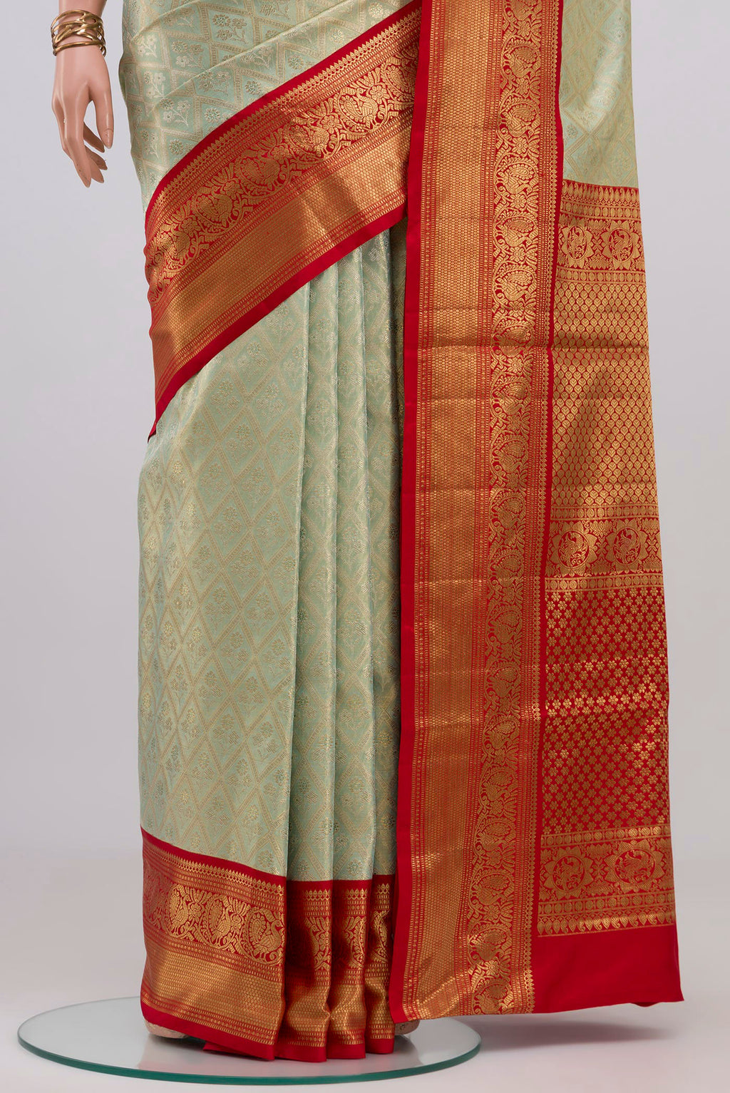 Pleats and pallu of Light Blue Kanjivaram Tissue Silk Saree with Zari Brocade on the body and Zari Border. 