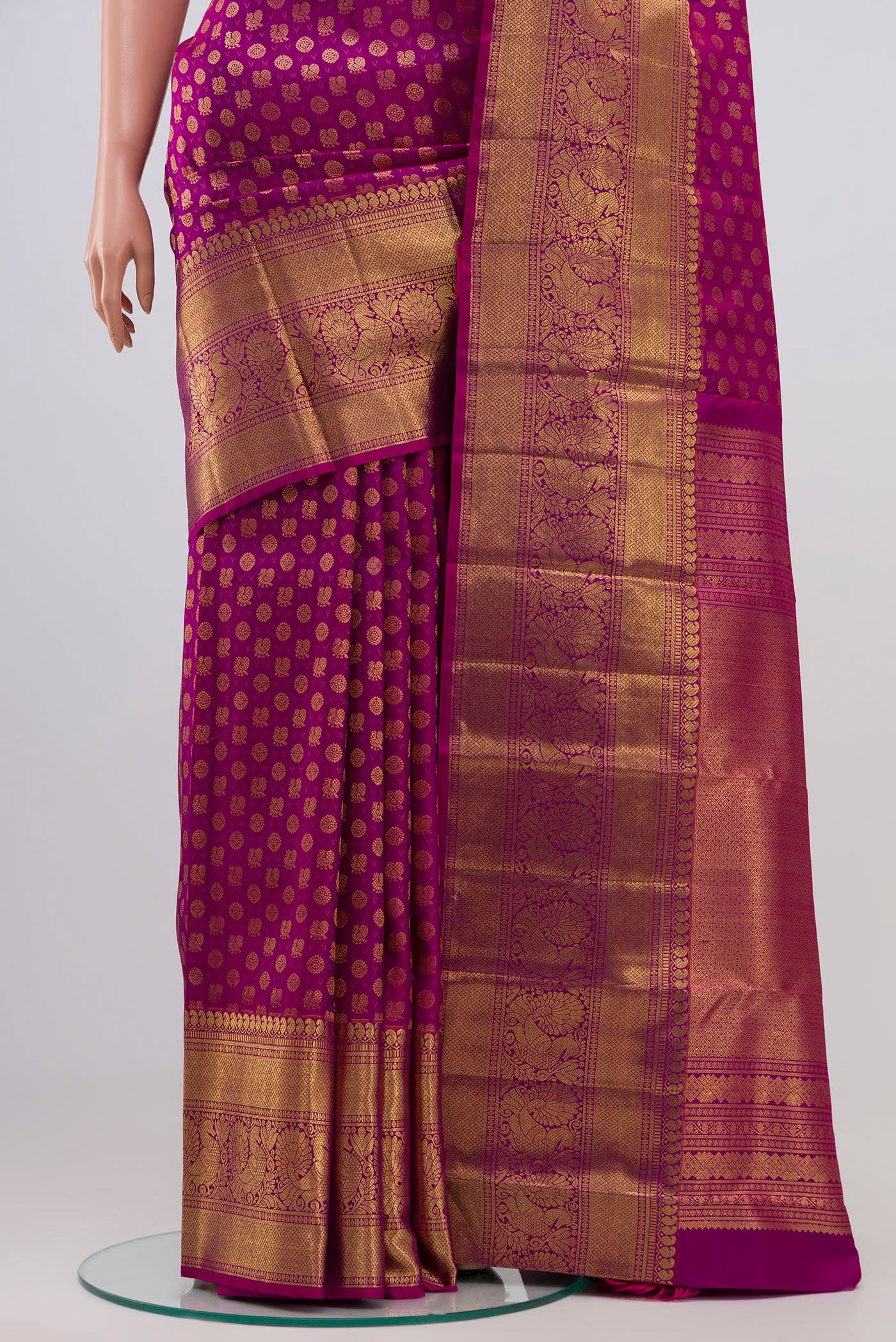 Pleats and pallu of Magenta Kanchipuram Silk Saree with Zari Brocade on the body and Zari Border. 