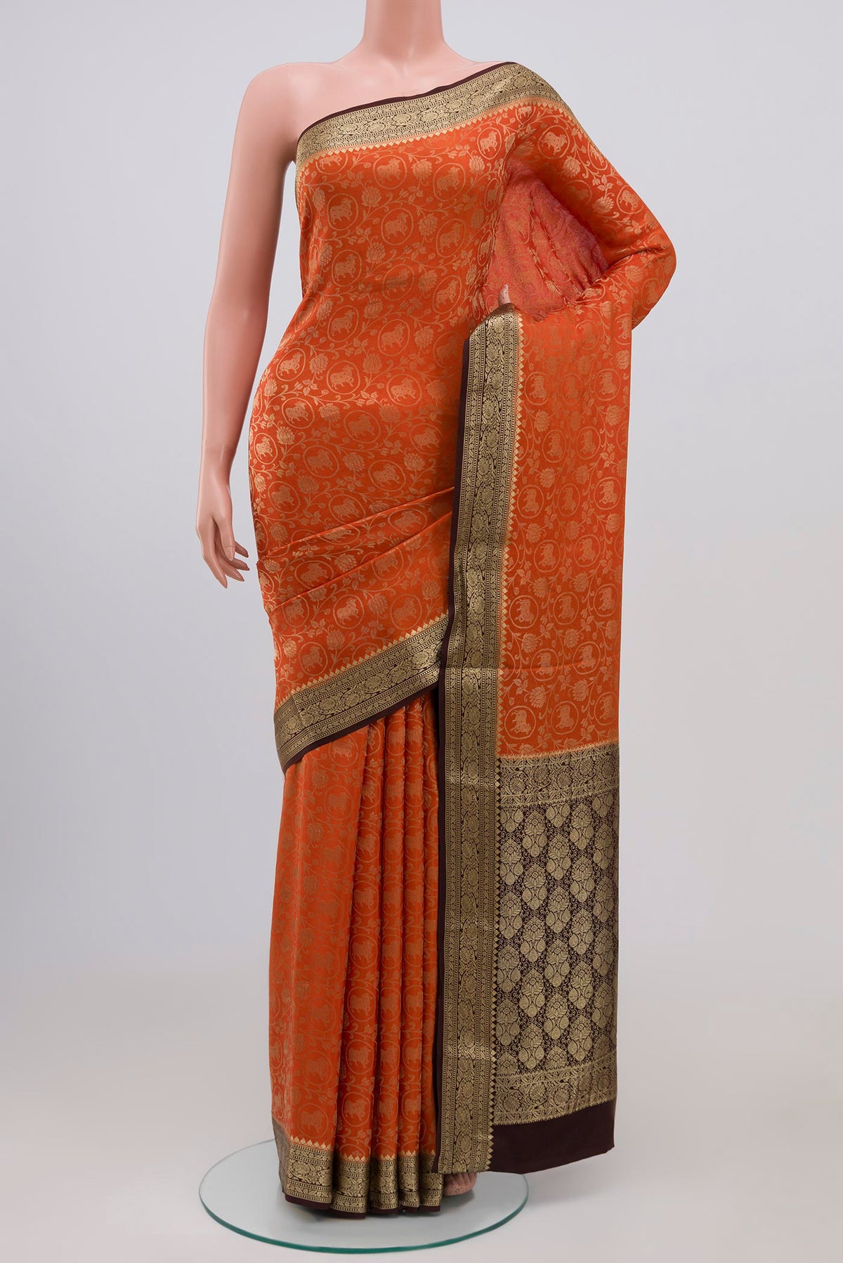 Orange Mysore Silk Saree with Zari Brocade on the body and Zari Border.  displayed on a mannequin