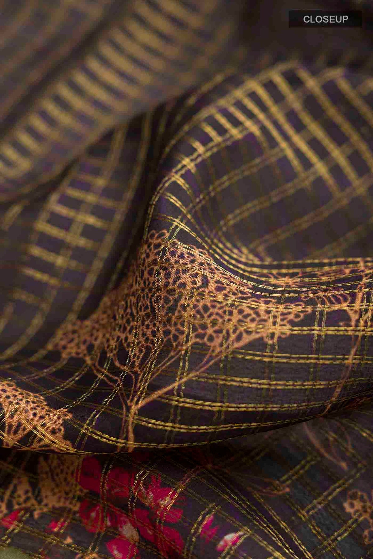 Close up of Black Mysore Crepe Saree with Checked design on the body and Zari Border displaying folds
