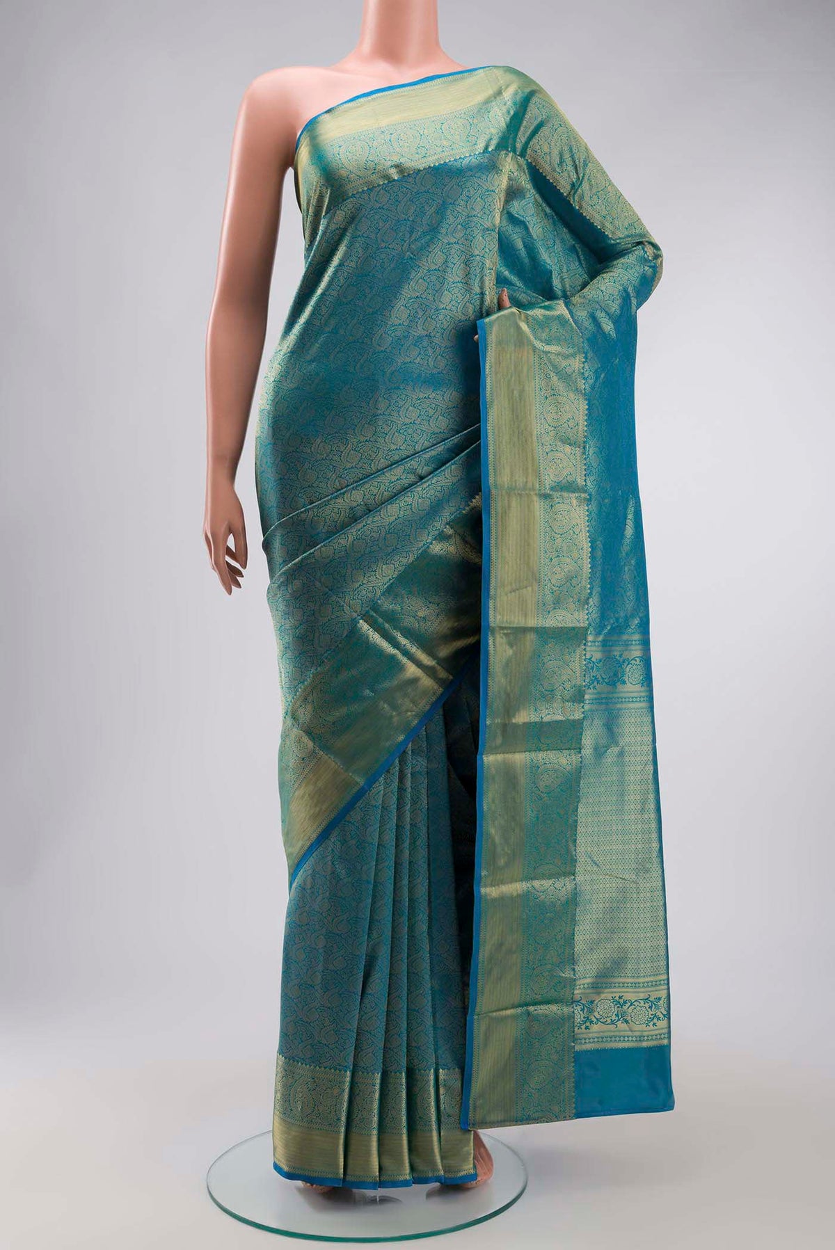 Blue Kanchipuram Silk Saree with Zari Brocade on the body and Zari Border displayed on a mannequin