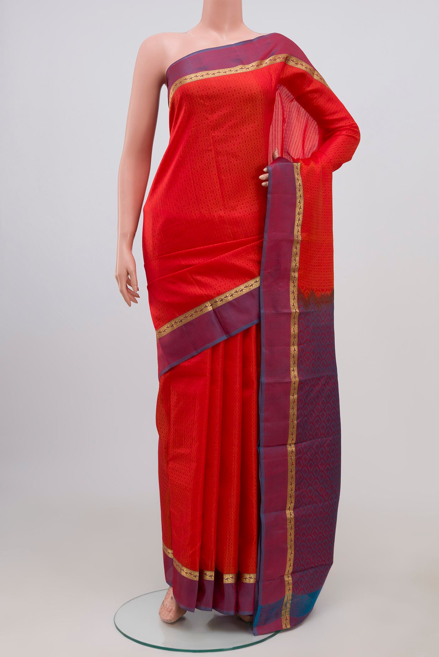 Red Kanchipuram Silk Saree with Jacquard design on the body and Thin Zari Line.  displayed on a mannequin