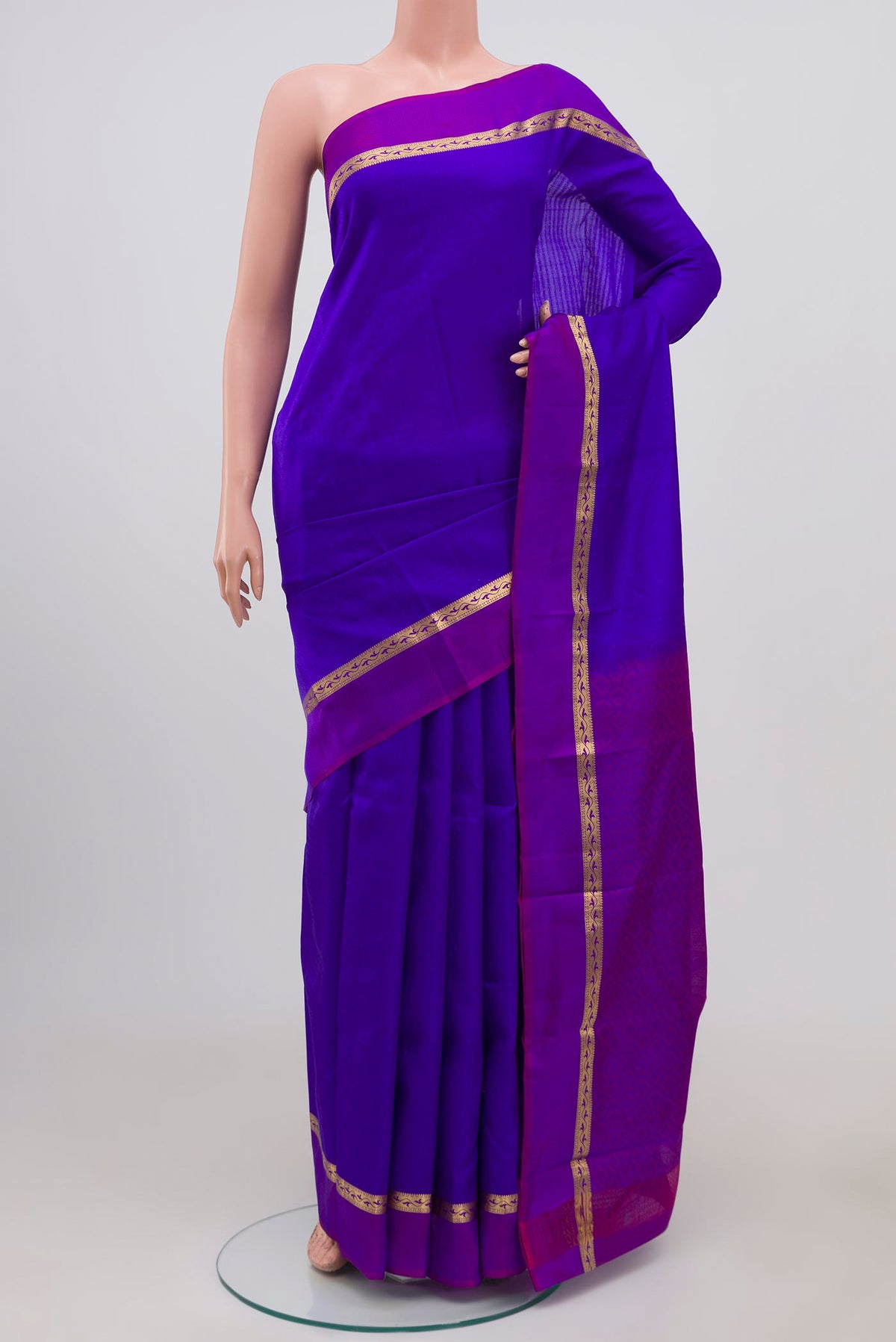 Blue Kanchipuram Silk Saree with Jacquard design on the body and Thin Zari Line.  displayed on a mannequin