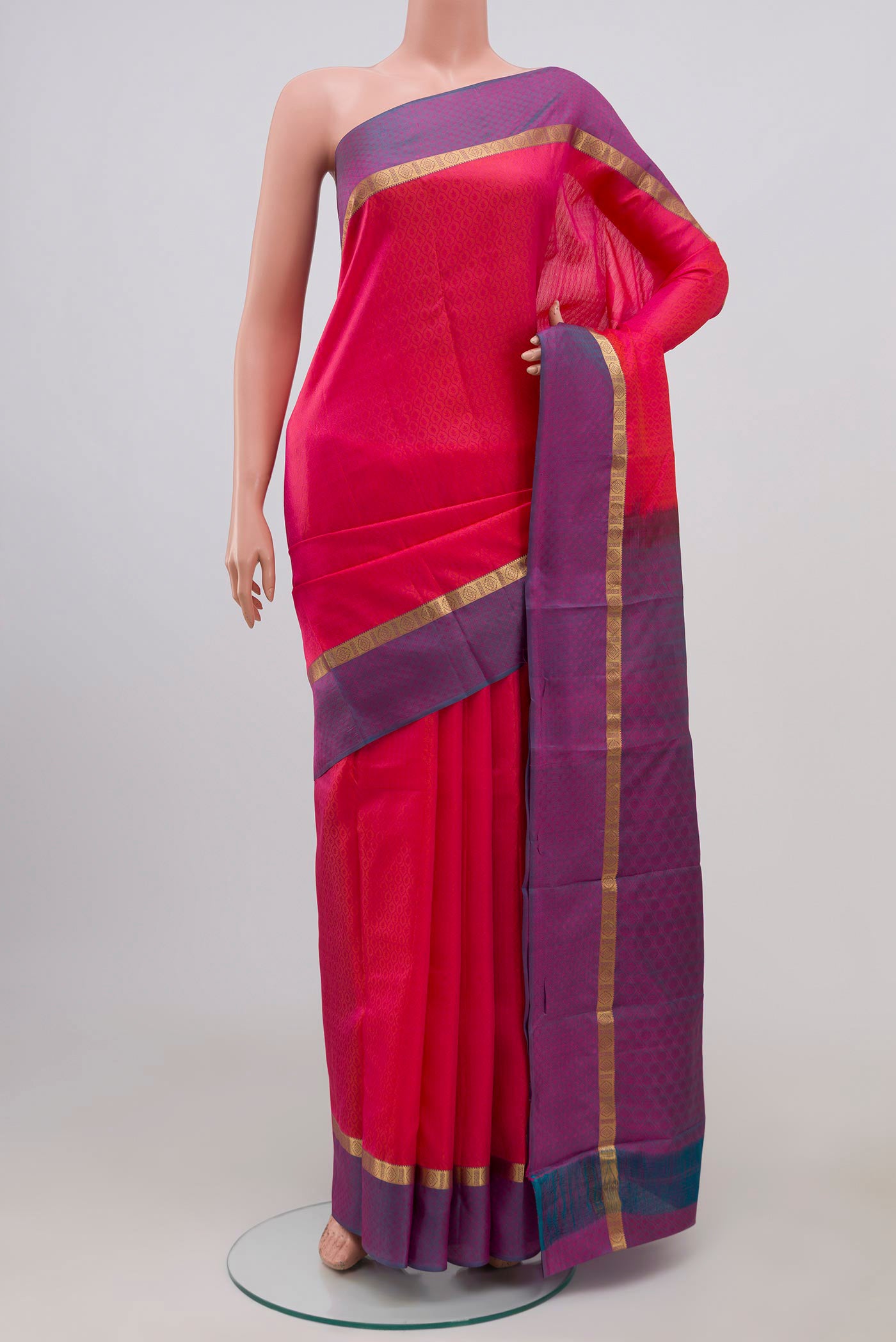 Pink Kanchipuram Silk Saree with Jacquard design on the body and Thin Zari Line.  displayed on a mannequin