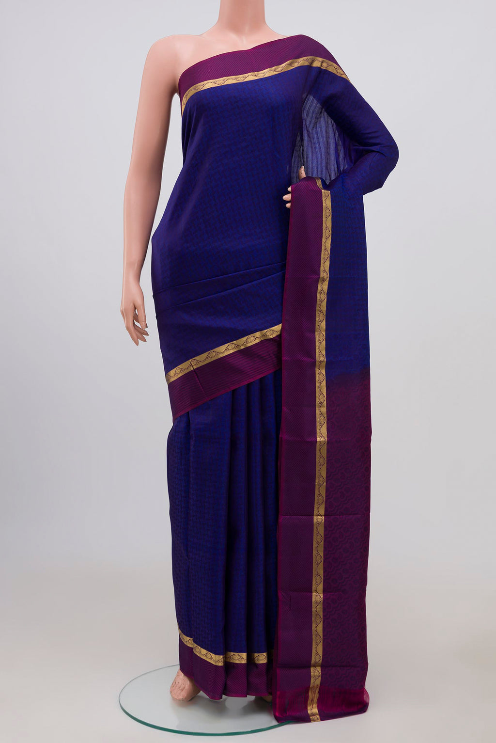 Blue Kanchipuram Silk Saree with Jacquard design on the body and Thin Zari Line.  displayed on a mannequin