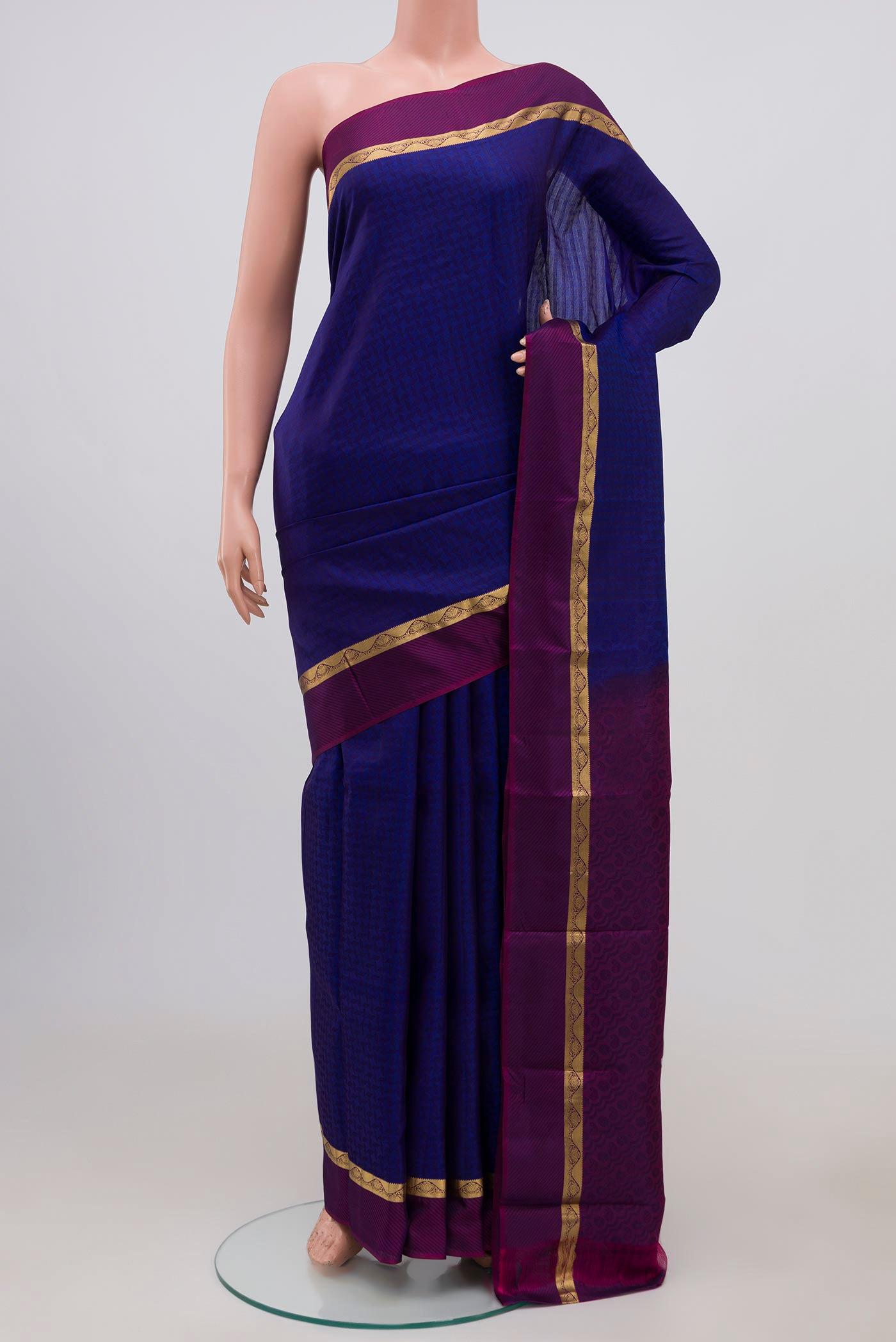 Blue Kanchipuram Silk Saree with Jacquard design on the body and Thin Zari Line.  displayed on a mannequin