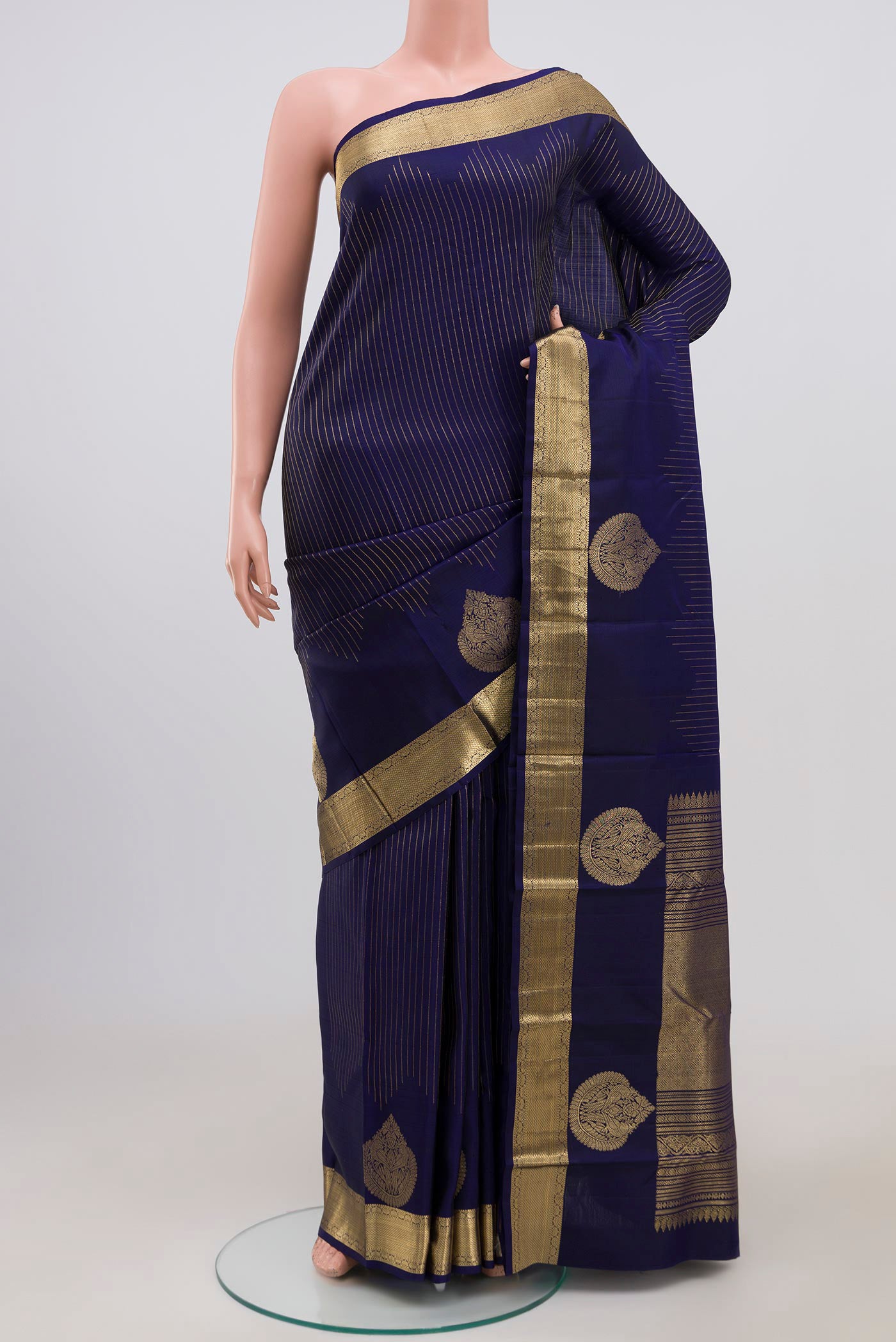 Blue Kanjivaram Saree with Stripes on the body and Zari Border.  displayed on a mannequin