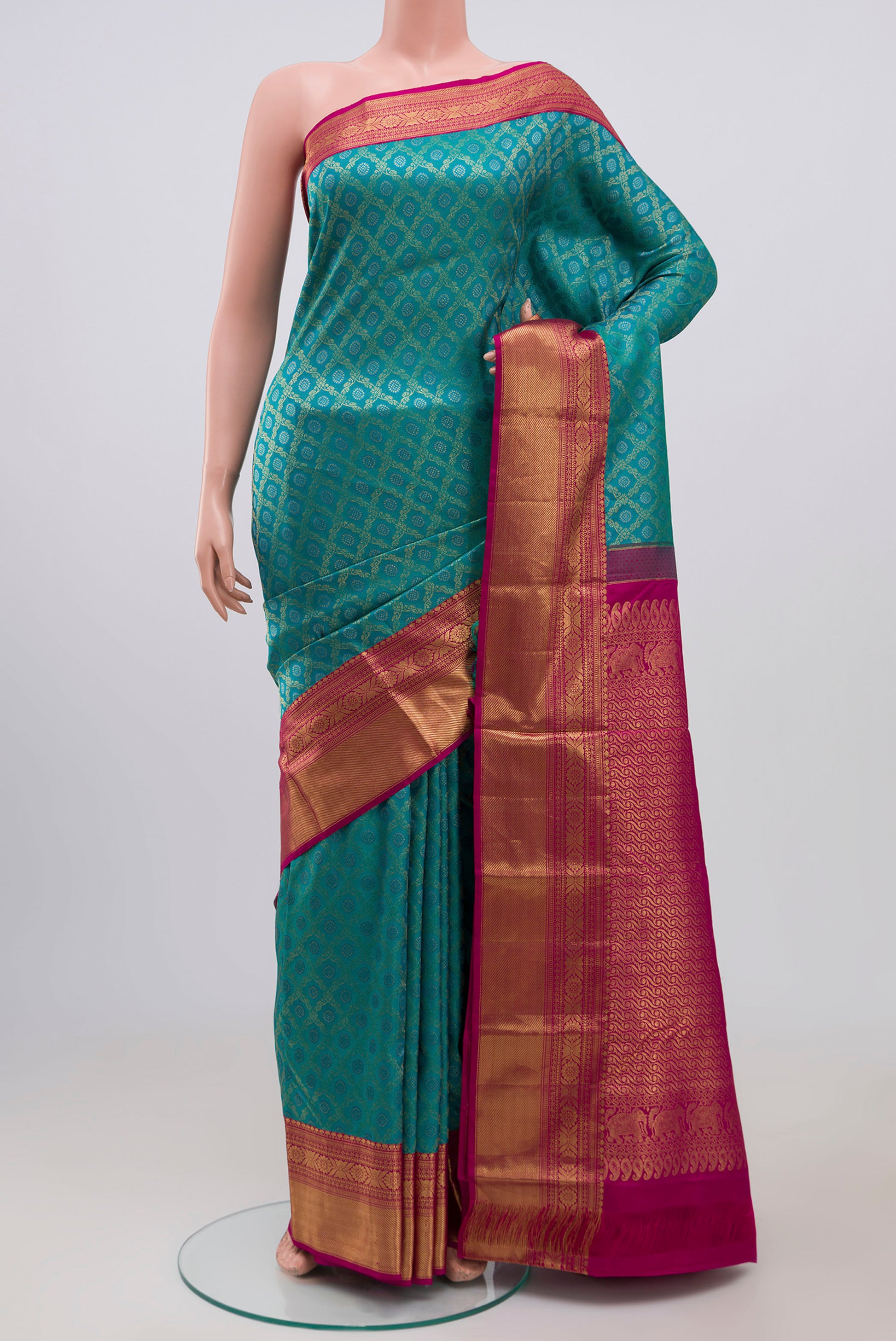 Peacock Blue Kanjivaram Silk Saree with Zari Brocade on the body and Zari Border.  displayed on a mannequin