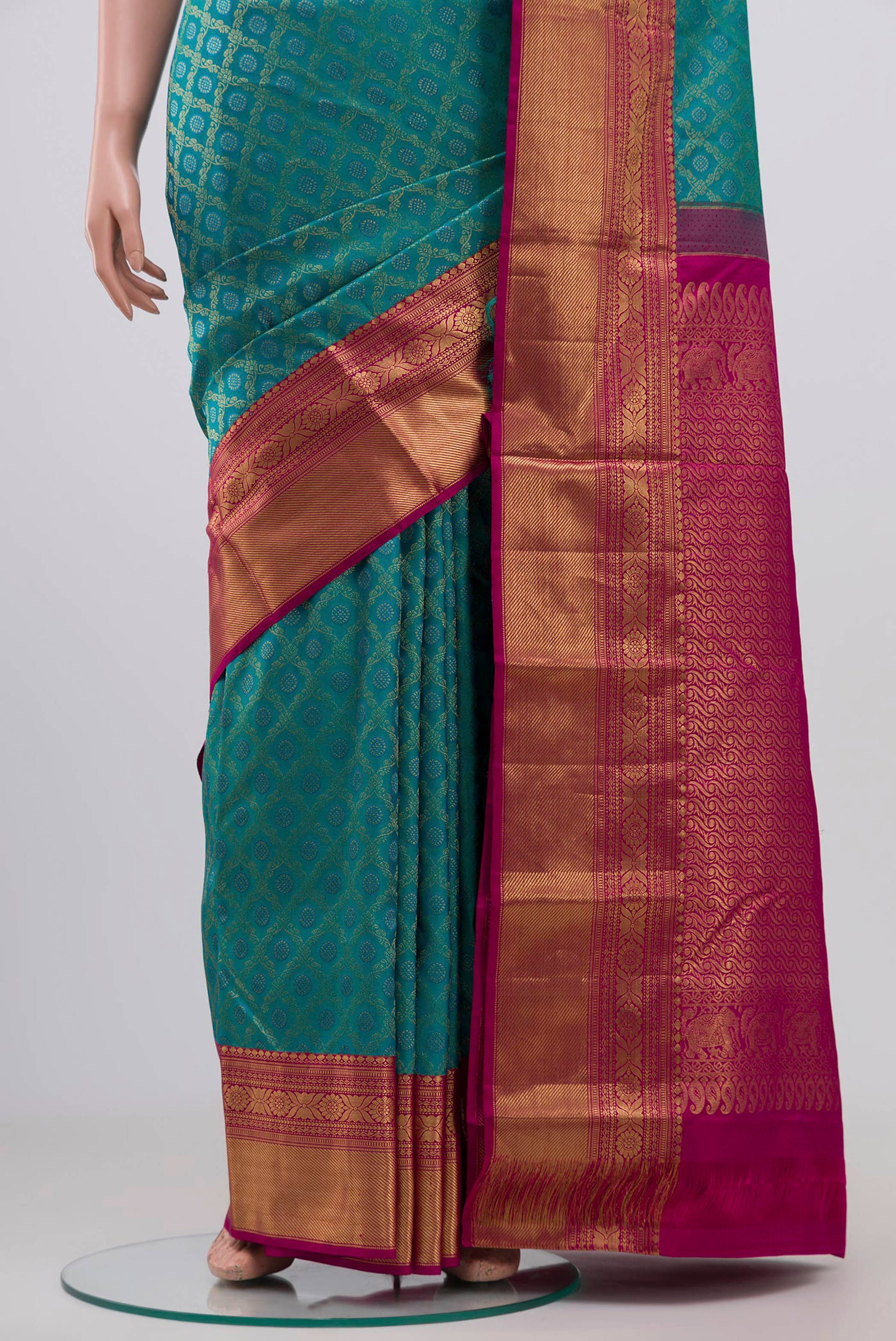 Pleats and pallu of Peacock Blue Kanjivaram Silk Saree with Zari Brocade on the body and Zari Border. 