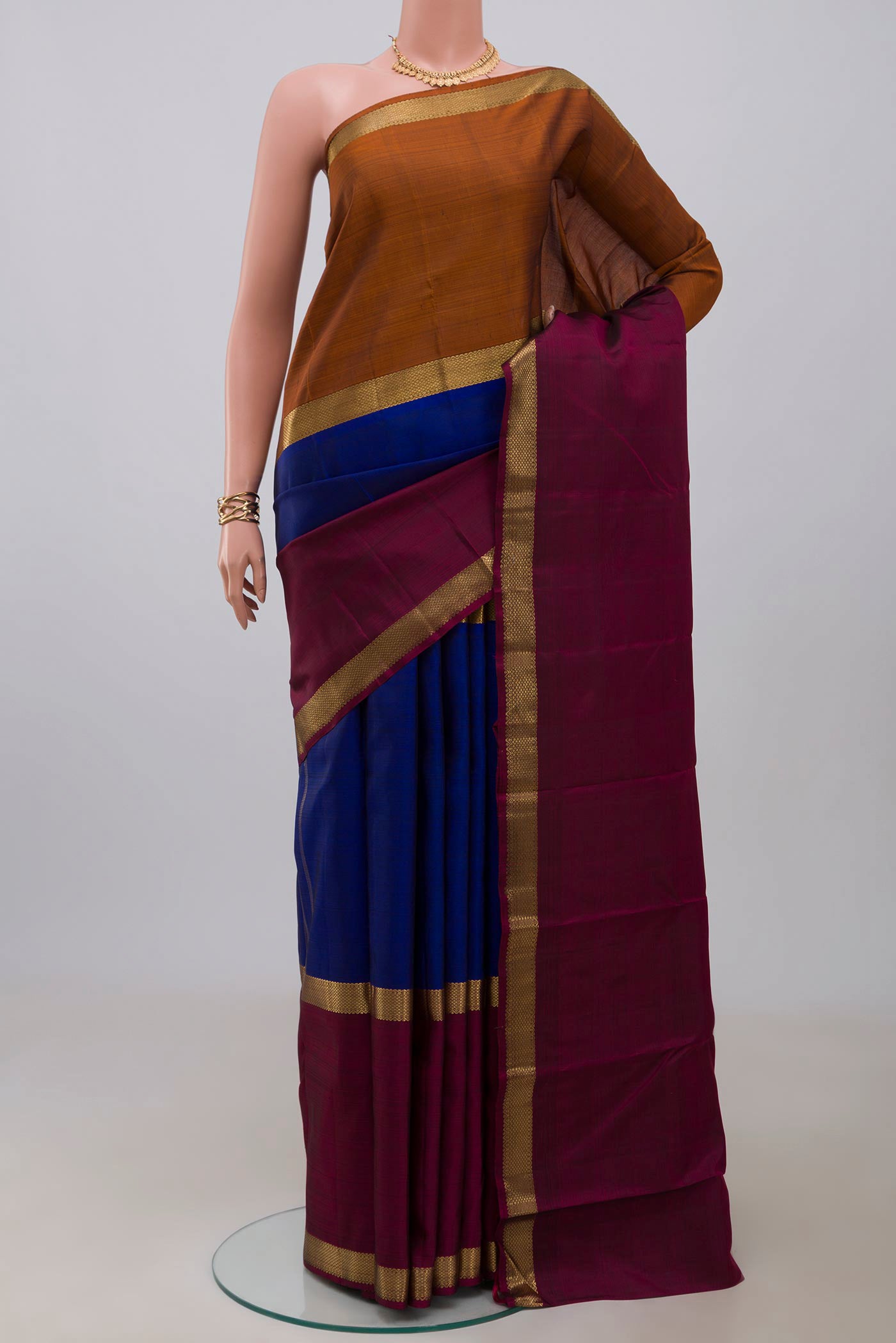 Pure Silk Pure Zari Blue Kanchipuram Saree with Plain Body and Ganga Jamuna Border.  displayed on a mannequin
