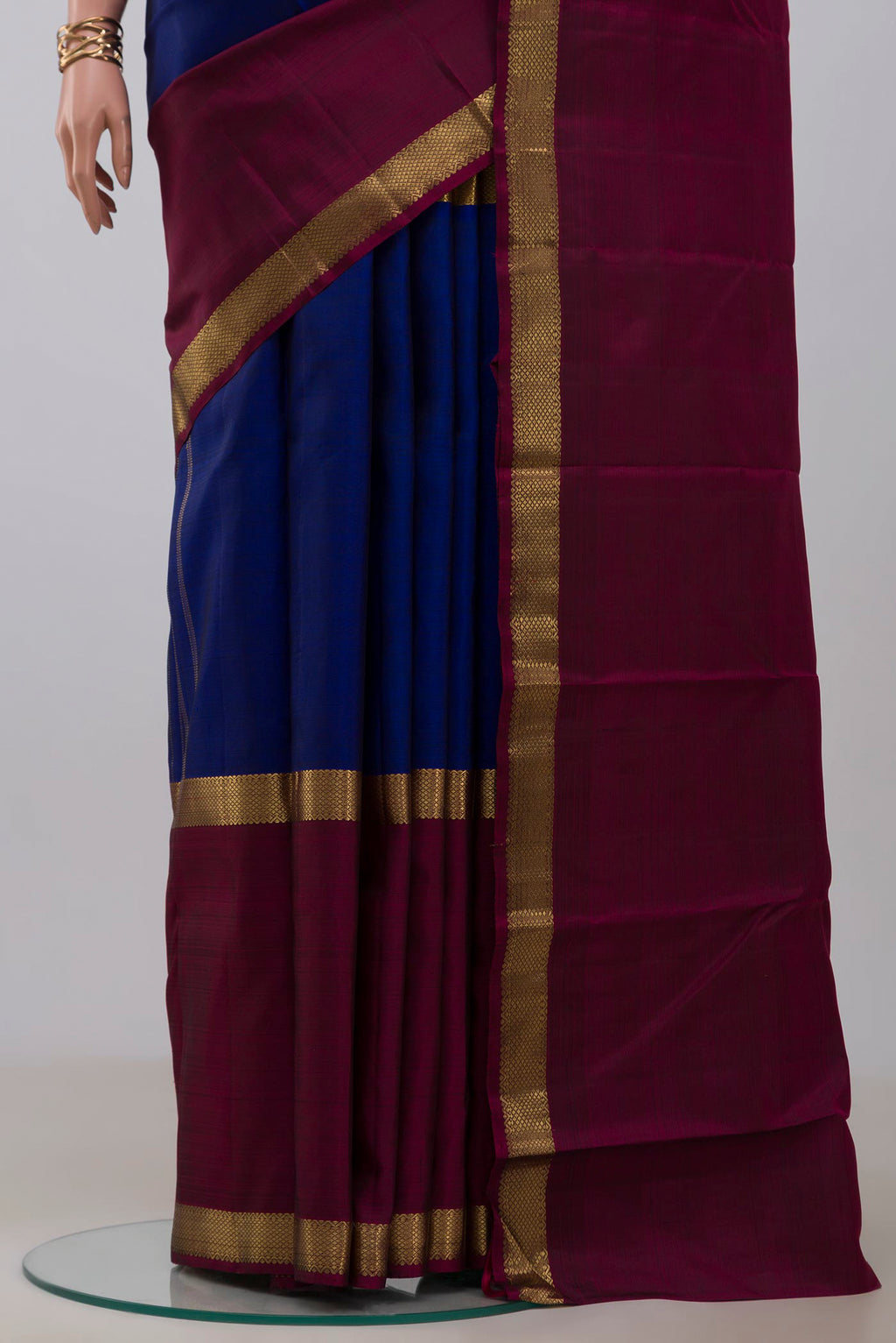 Pleats and pallu of Pure Silk Pure Zari Blue Kanchipuram Saree with Plain Body and Ganga Jamuna Border. 