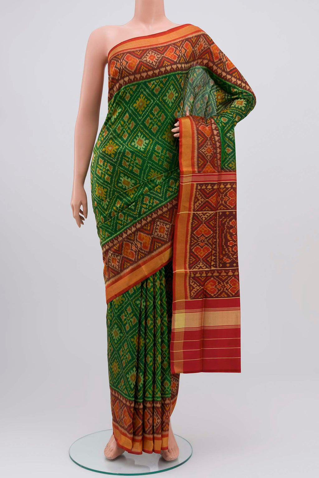 Green Rajkot Patola Silk Saree with Pure Ikat on the body and Zari Border displayed on a mannequin
