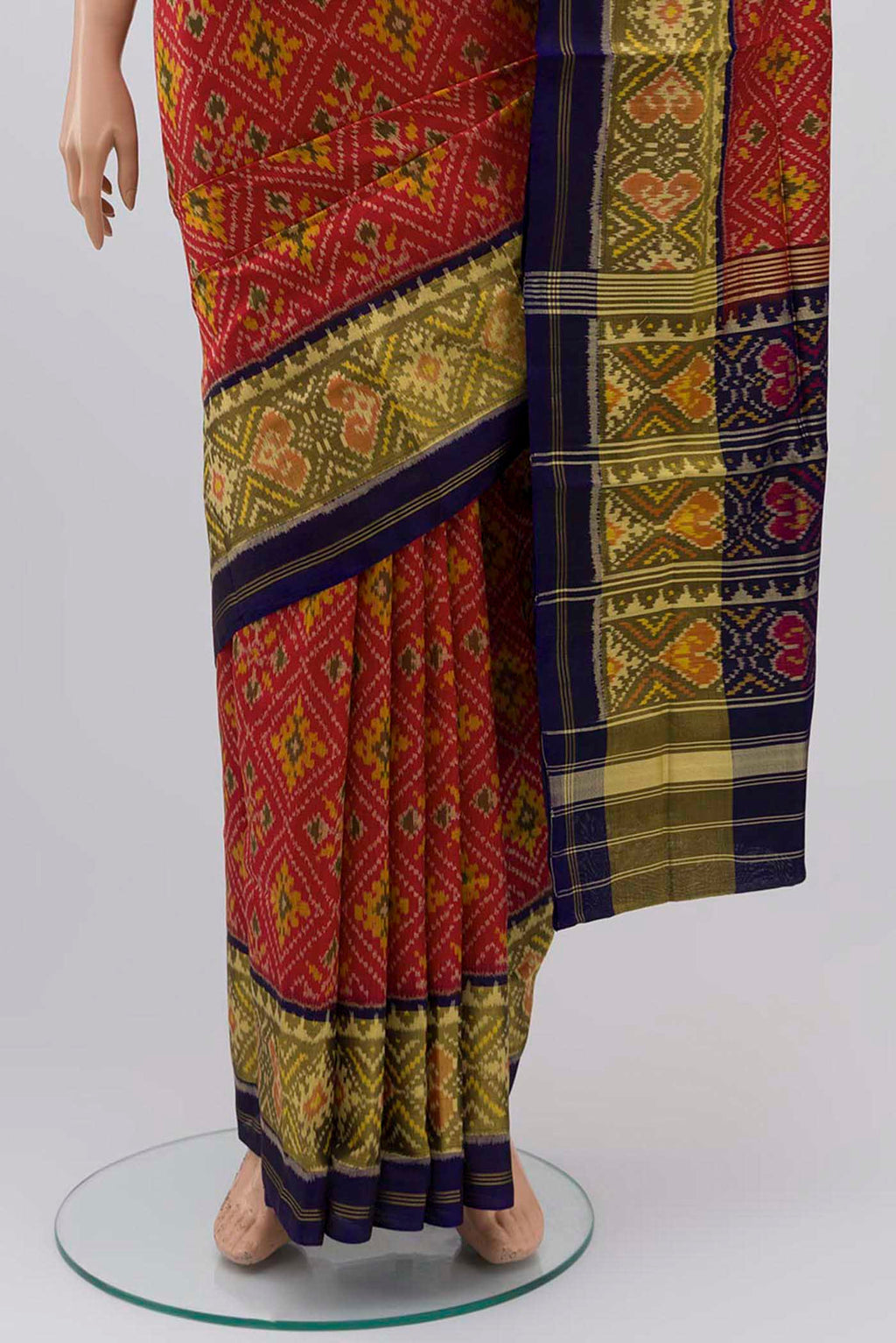 Pleats and pallu of Red Rajkot Patola Silk Saree with Ikat design on the body and Thin Zari Line