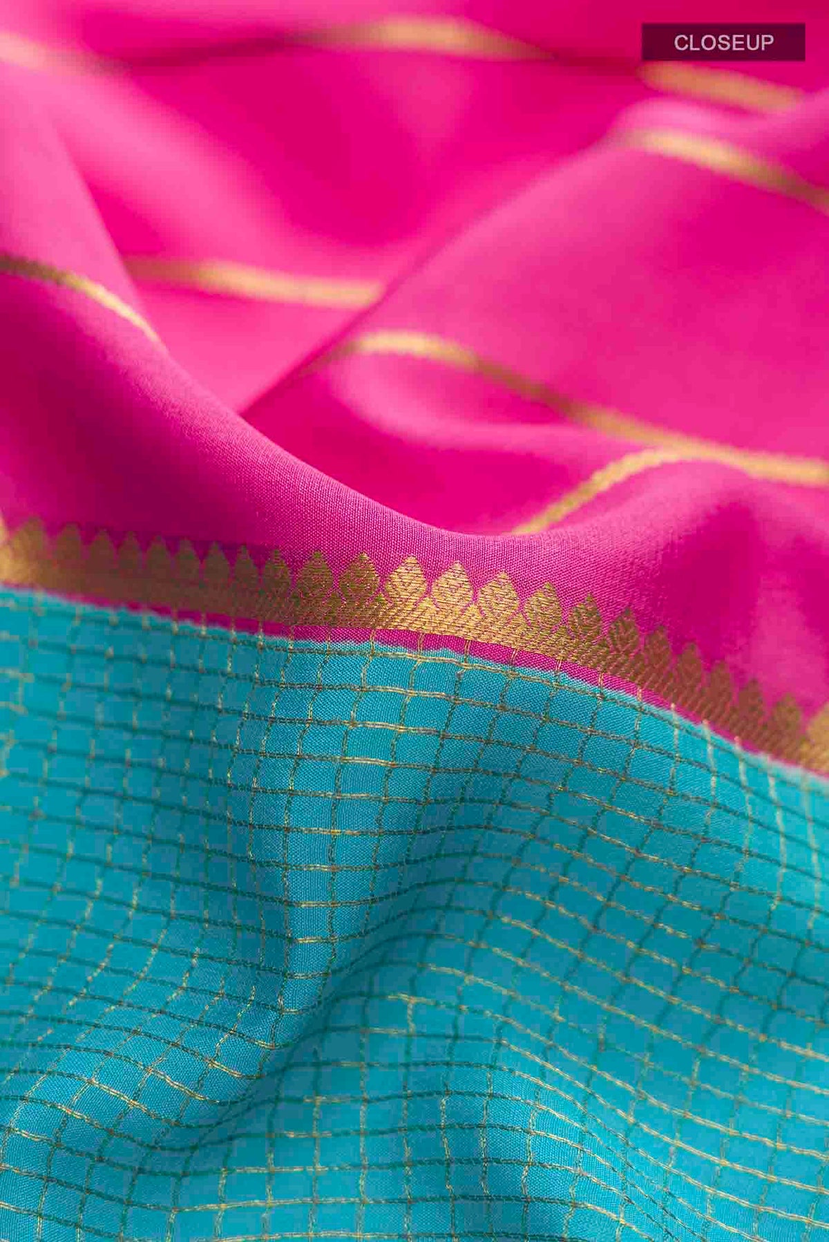 Close up of Multi Color Mysore Crepe Saree with Stripes on the body and Zari Border displaying folds