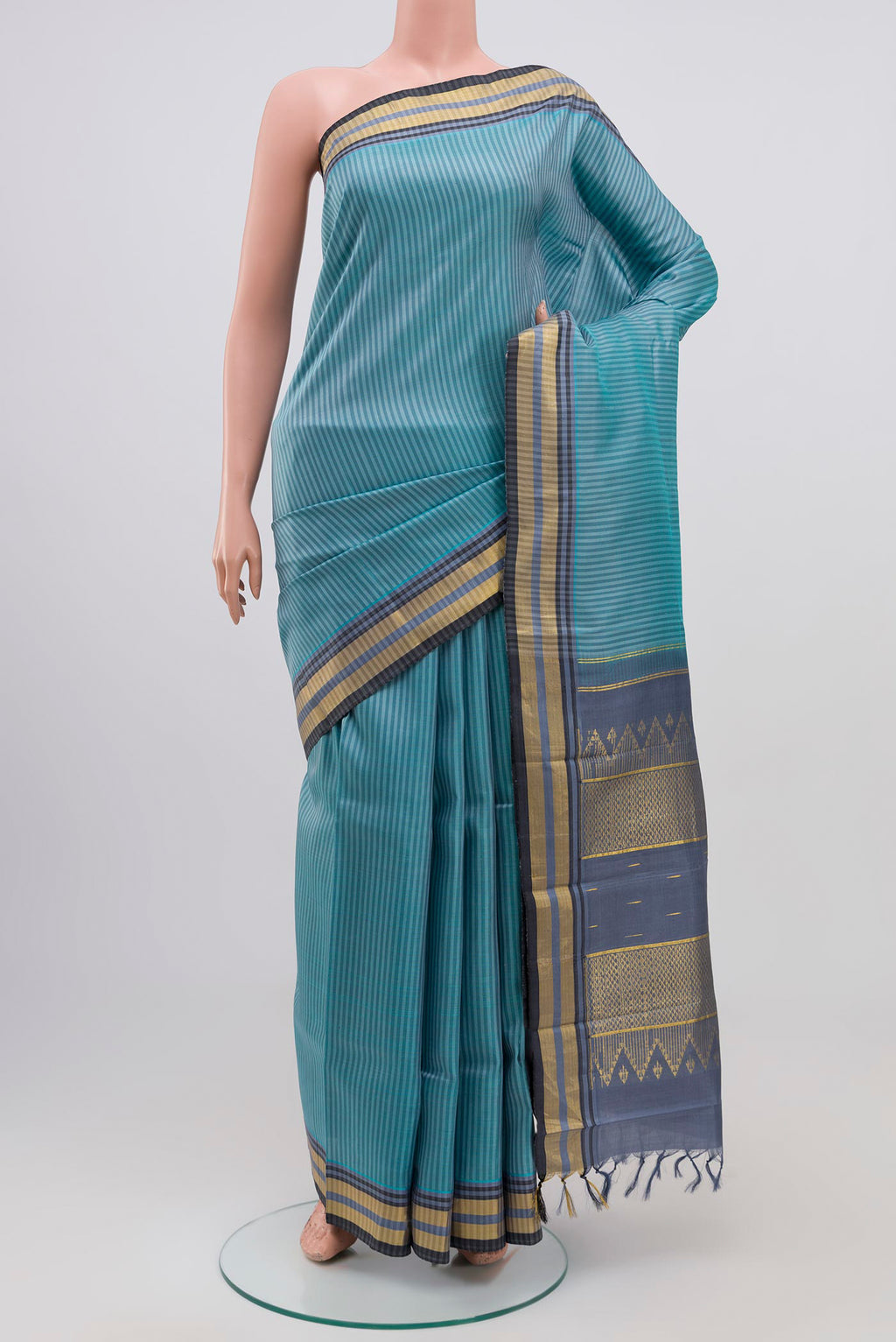Blue Grey Kanjivaram Silk Saree with Stripes on the body and Zari Border.  displayed on a mannequin