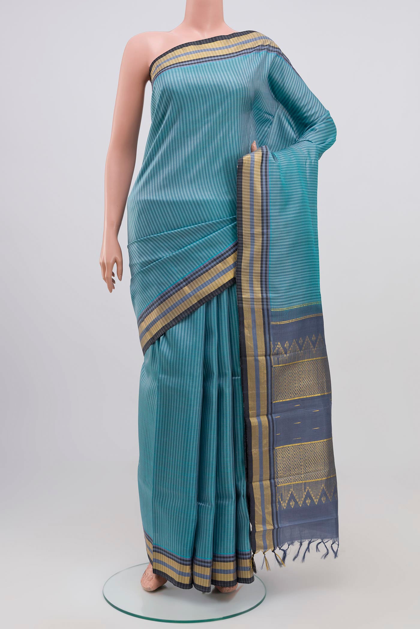 Blue Grey Kanjivaram Silk Saree with Stripes on the body and Zari Border.  displayed on a mannequin
