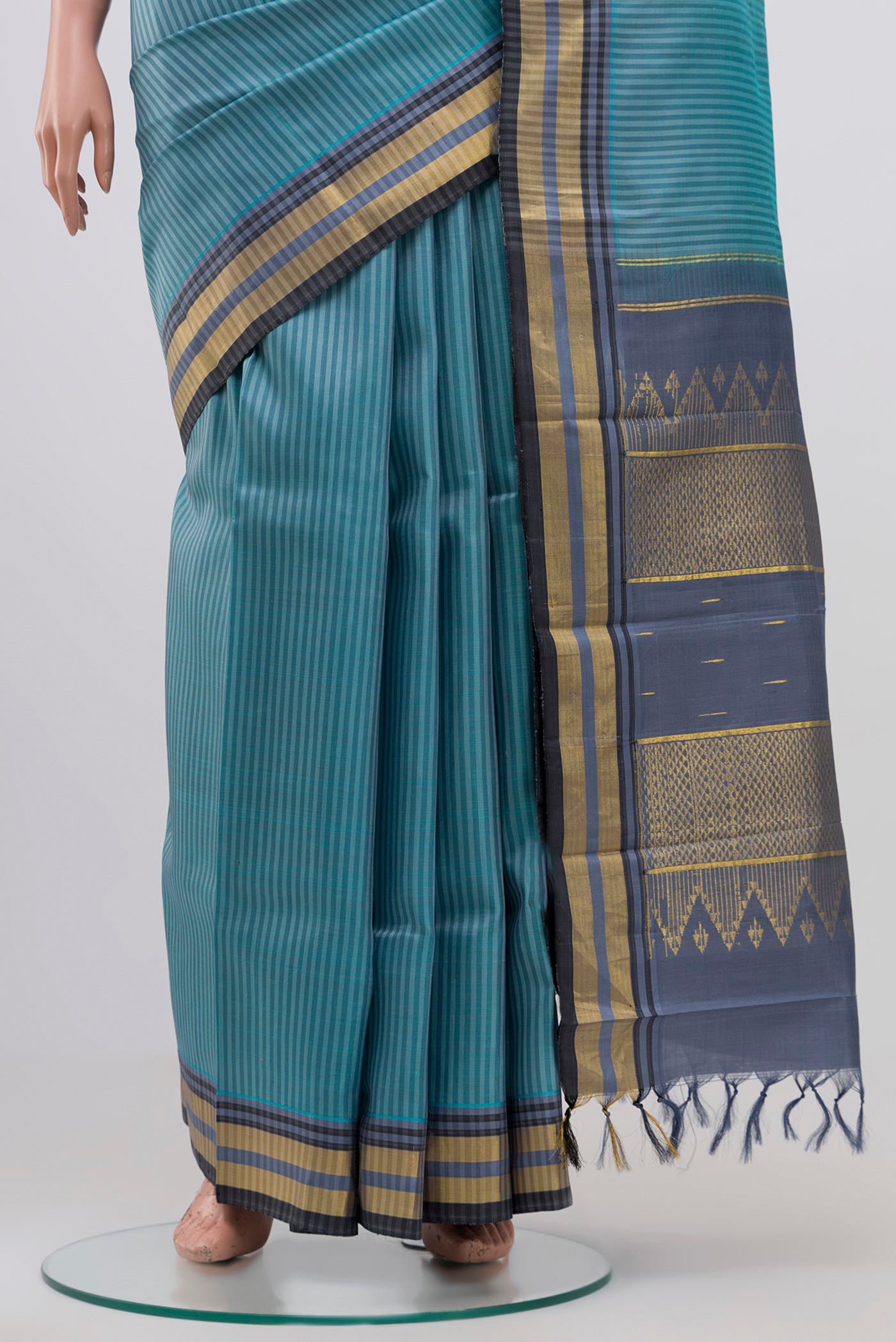 Pleats and pallu of Blue Grey Kanjivaram Silk Saree with Stripes on the body and Zari Border. 