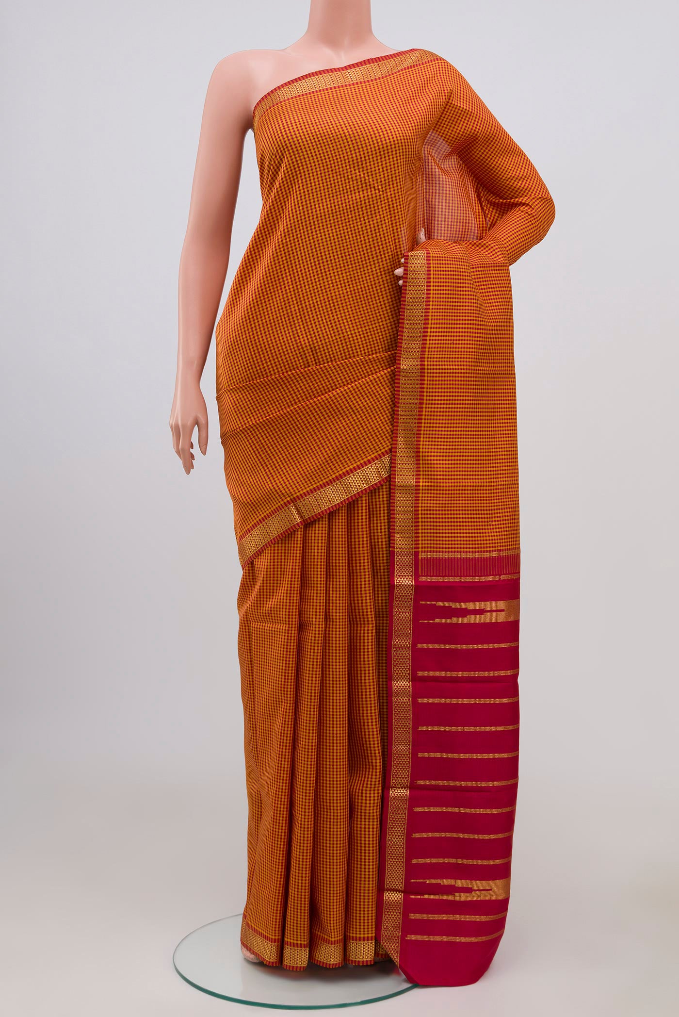 Pure Silk Pure Zari Multi Color Kanjivaram Saree with Checked design on the body and Zari Border.  displayed on a mannequin