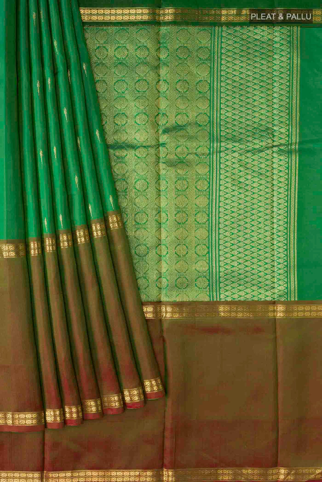 Pleats and pallu of Green Kanchipuram Silk Saree with Zari Butta on the body and Zari Border