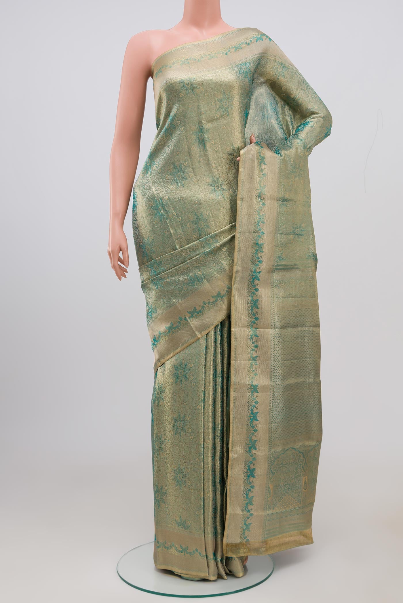 Light Blue Kanjivaram Silk Saree with Zari Brocade on the body and Zari Border.  displayed on a mannequin