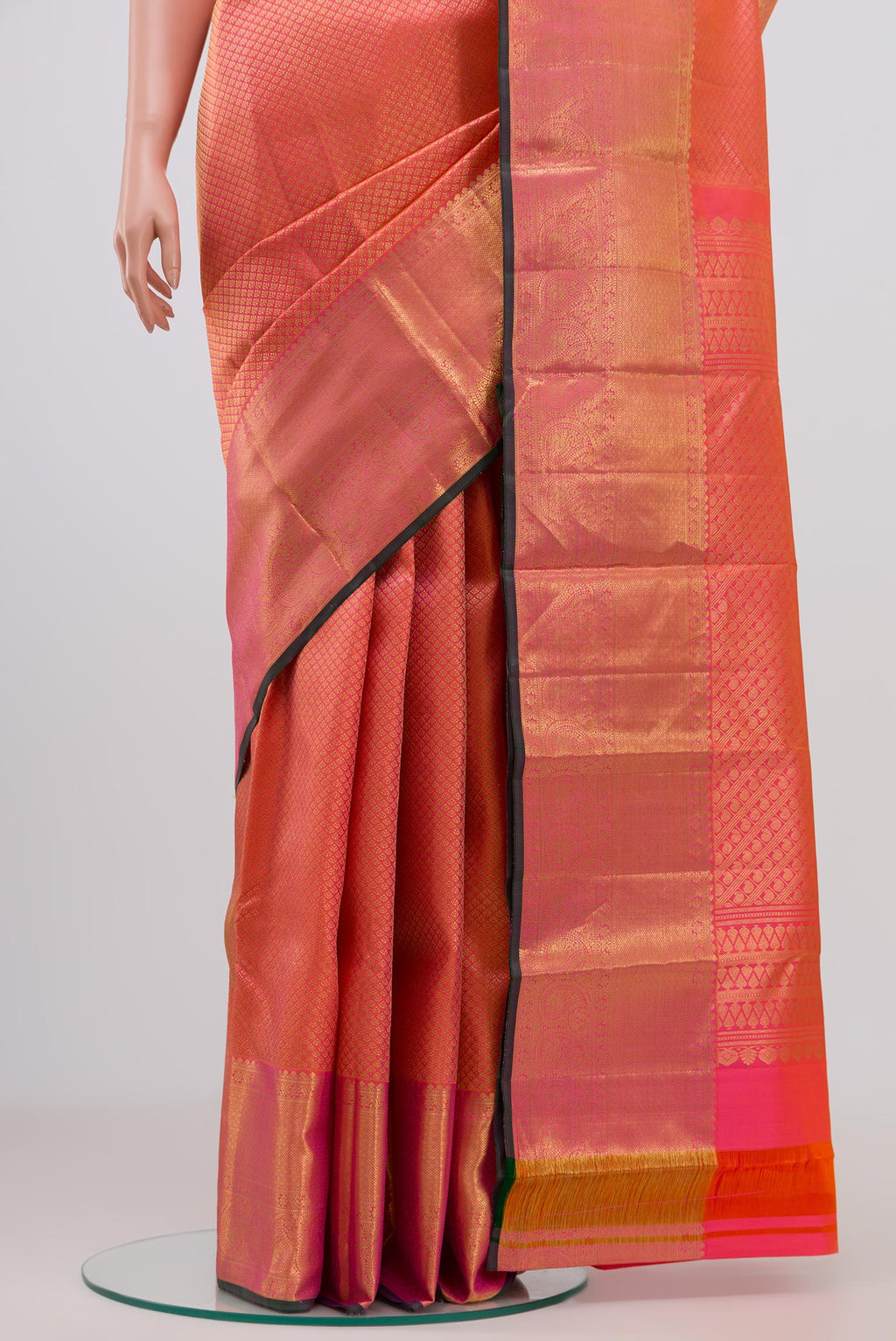 Pleats and pallu of Orange Kanjivaram Saree with Zari Brocade on the body and Zari Border. 