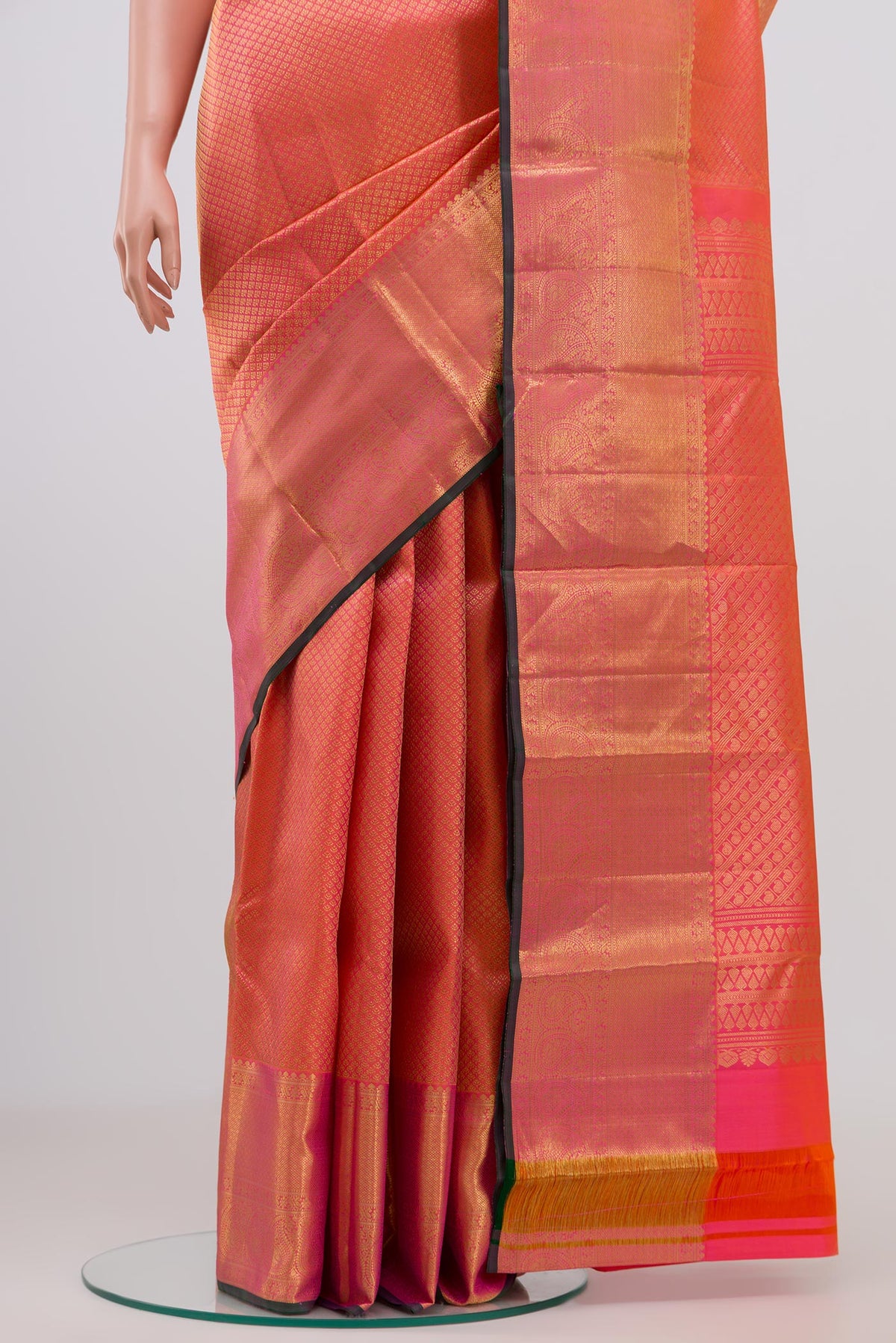 Pleats and pallu of Orange Kanjivaram Saree with Zari Brocade on the body and Zari Border. 