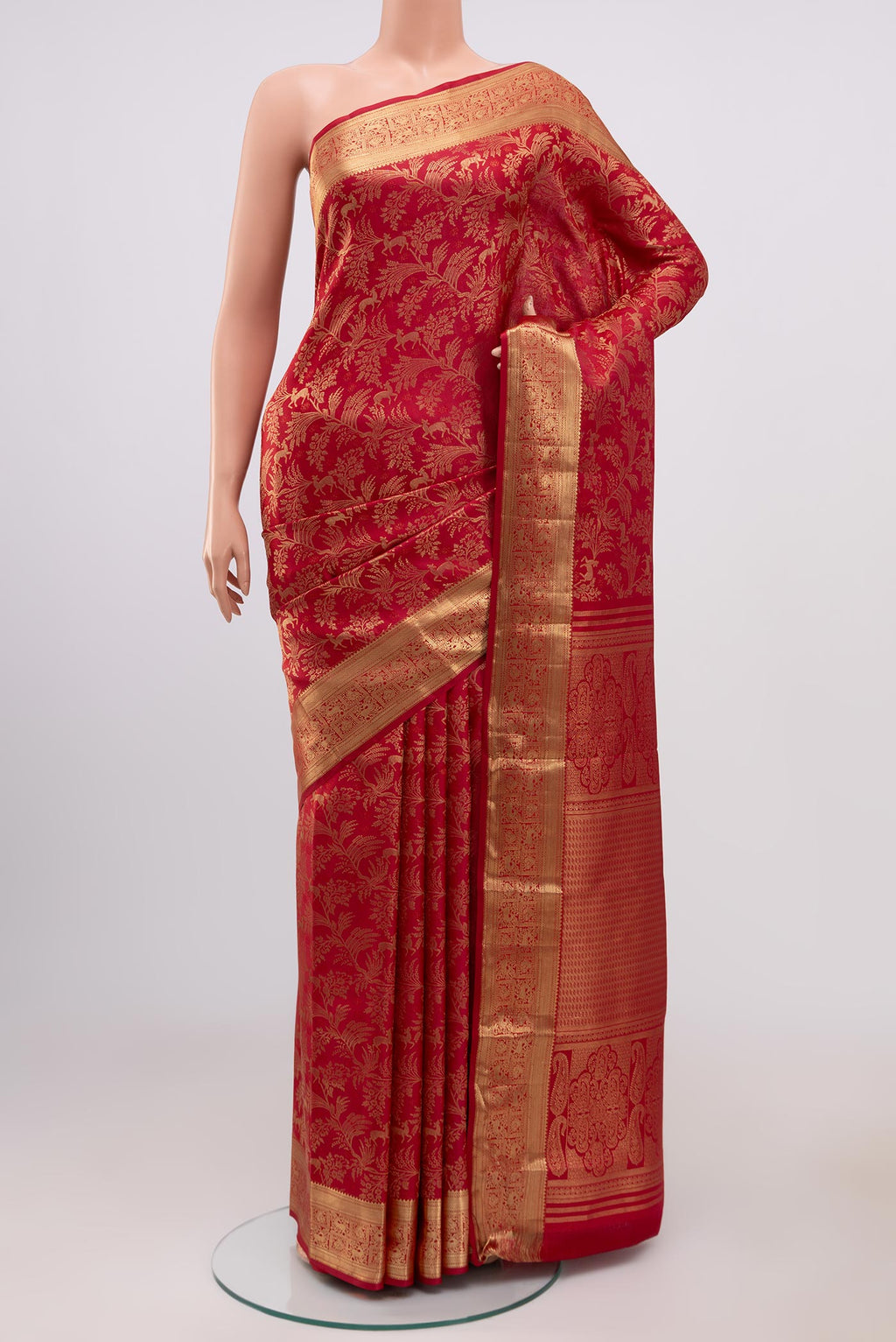Deep Red Kanjivaram Silk Saree with Zari Brocade on the body and Zari Border.  displayed on a mannequin