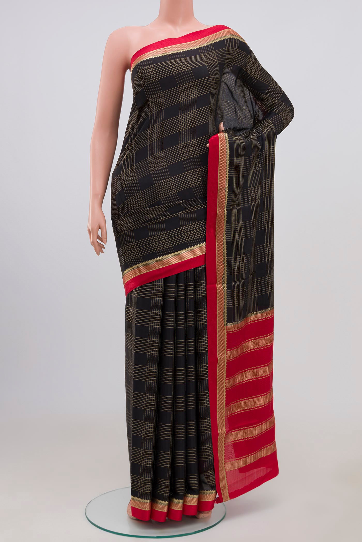 Black Mysore Crepe Saree with Checked design on the body and Thin Zari Line.  displayed on a mannequin