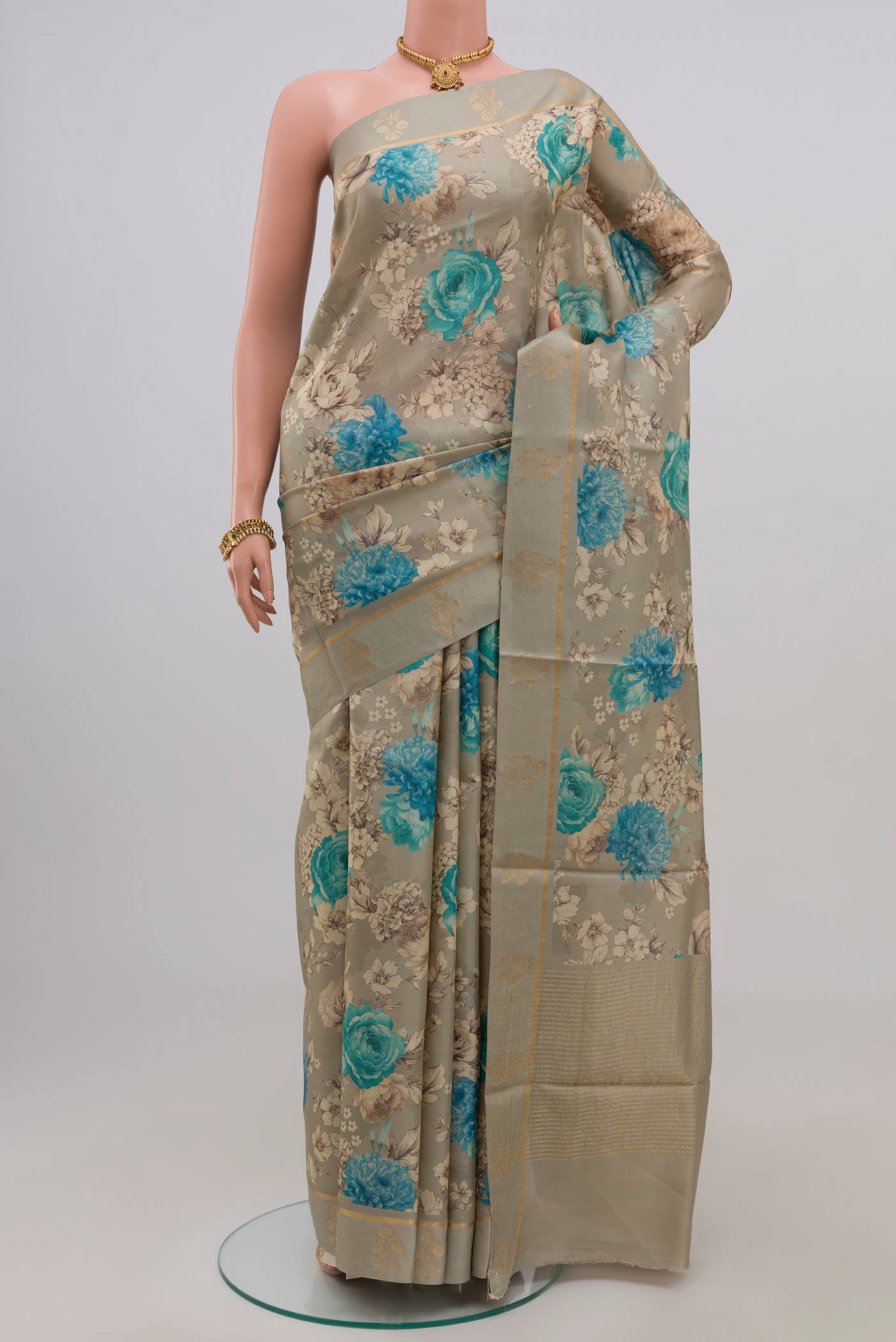 Green Tussar Silk Saree with Fancy on the body and Thin Zari Line.  displayed on a mannequin