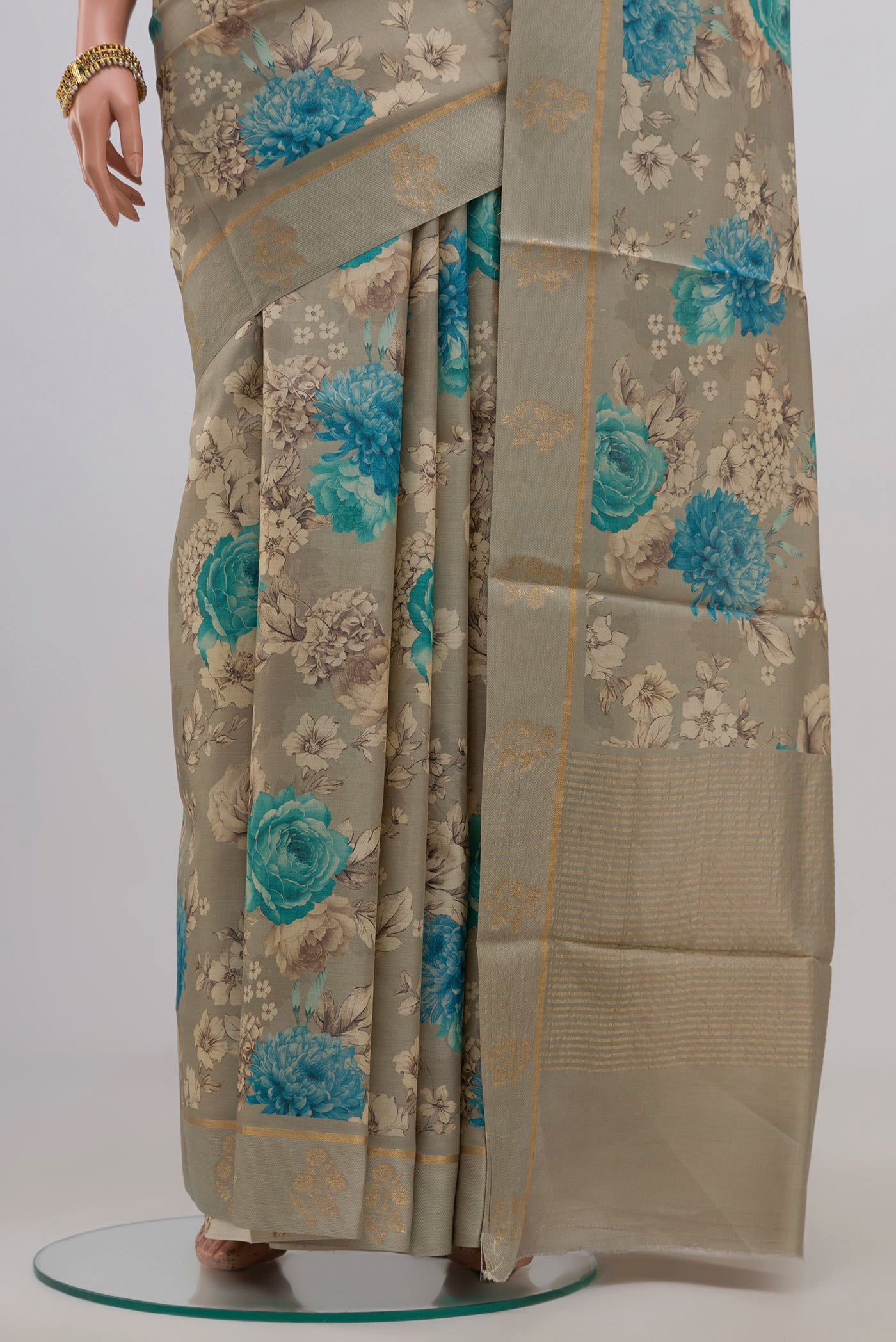 Pleats and pallu of Green Tussar Silk Saree with Fancy on the body and Thin Zari Line. 