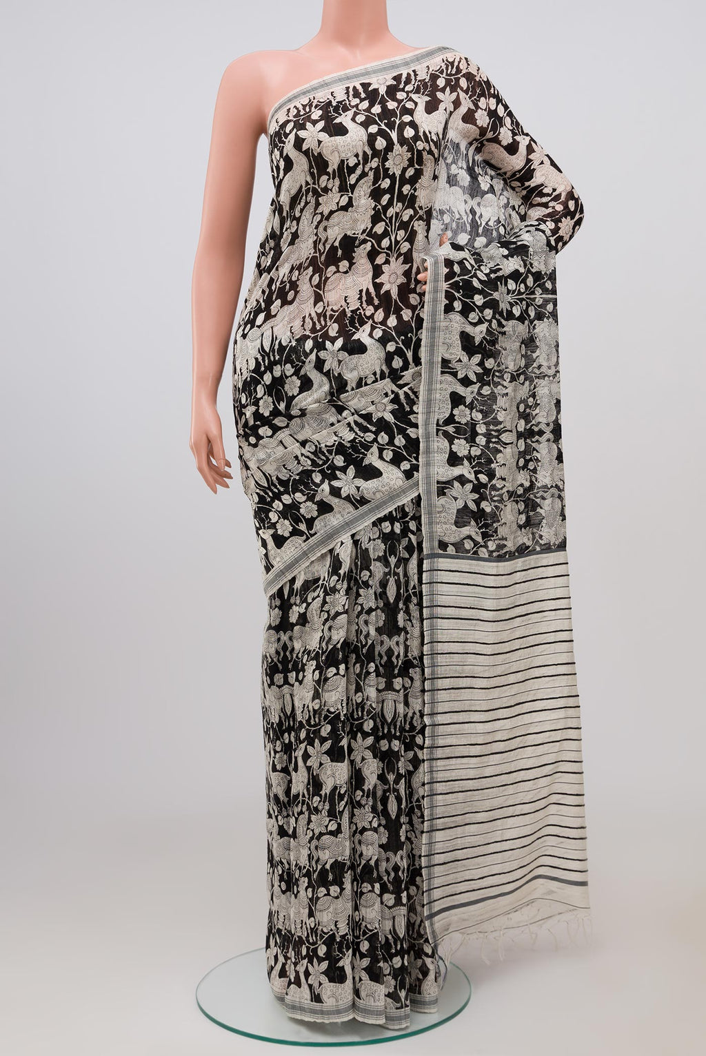 Black Tussar Silk Saree with Fancy on the body and Plain Border.  displayed on a mannequin