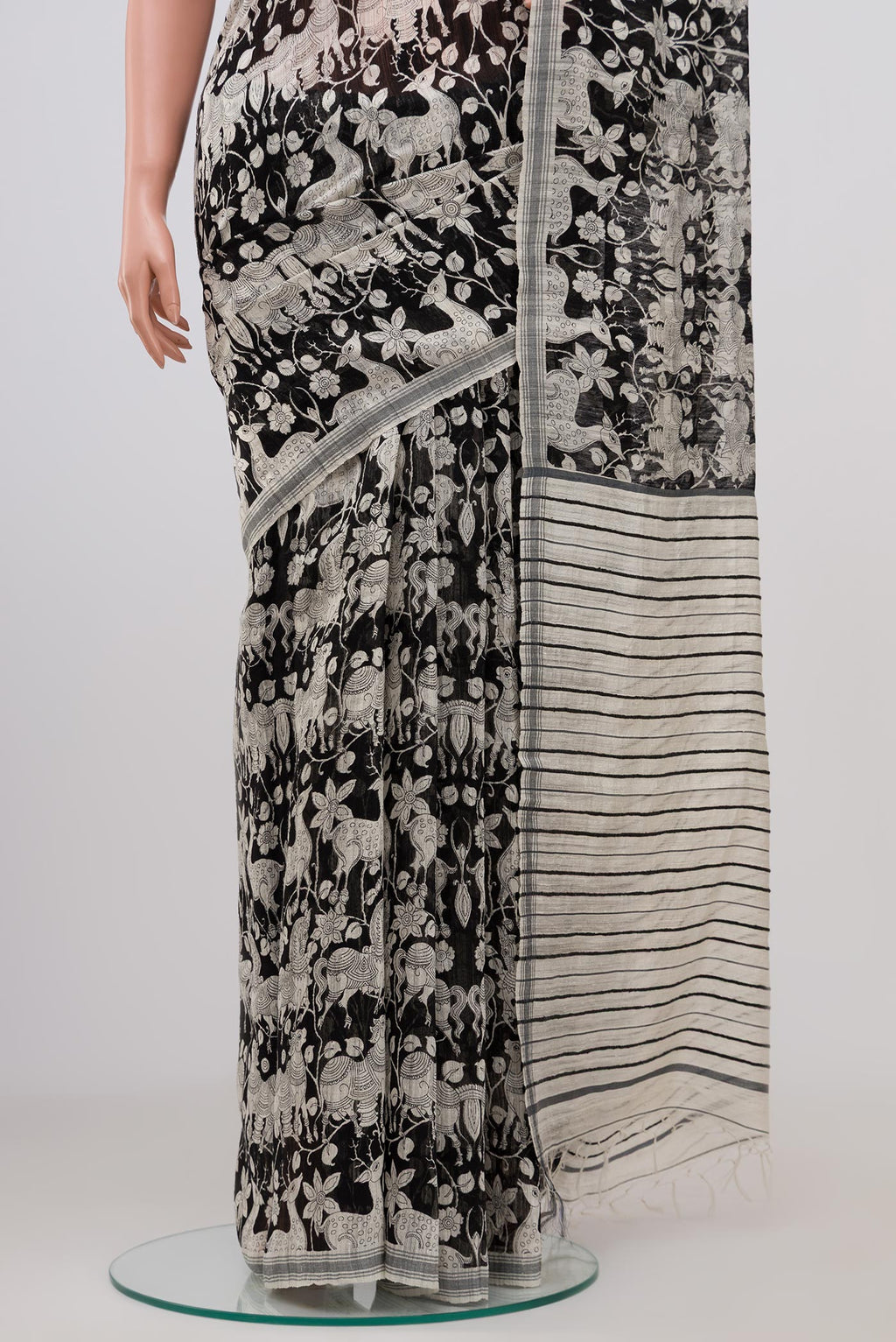 Pleats and pallu of Black Tussar Silk Saree with Fancy on the body and Plain Border. 
