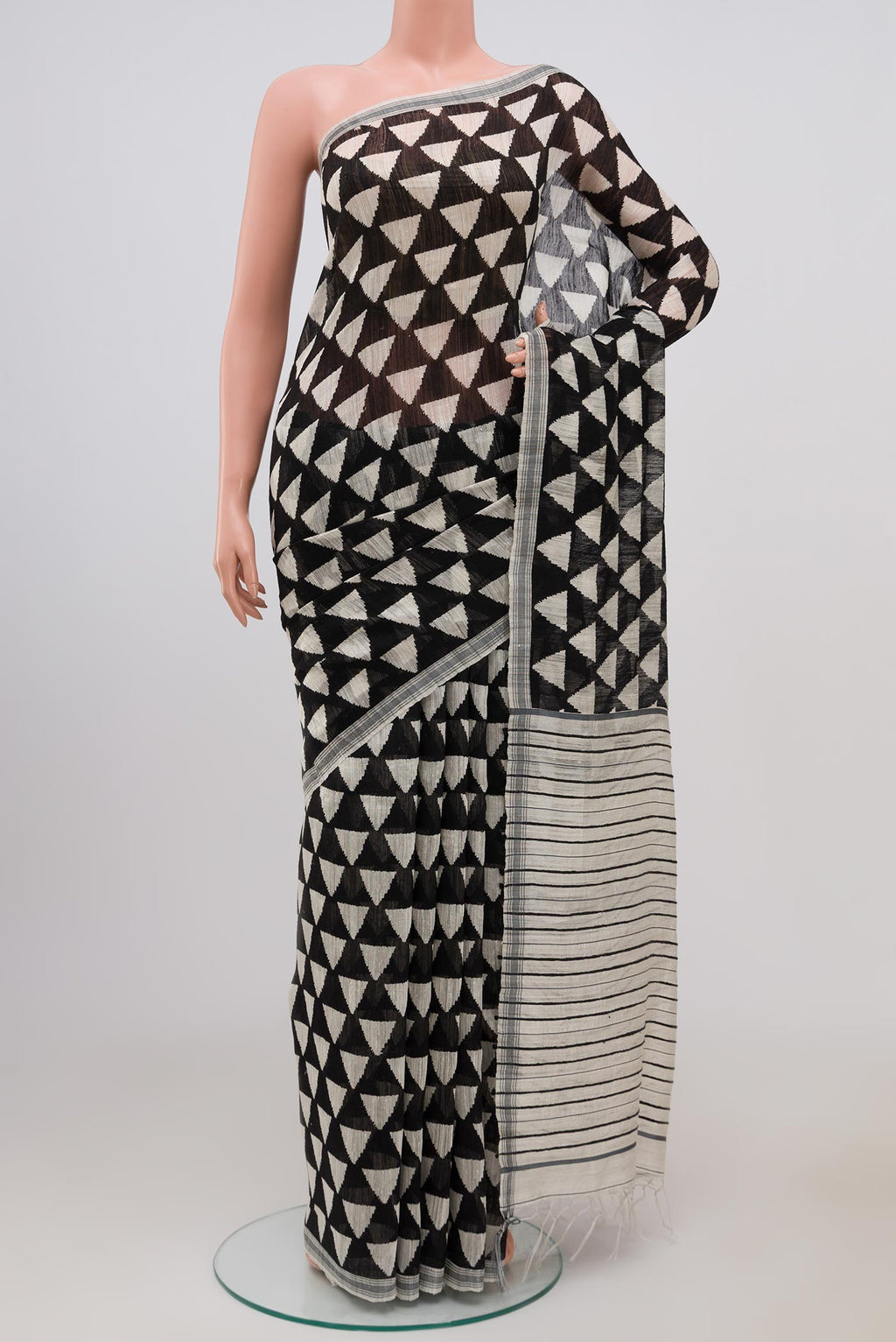 Black Tussar Silk Saree with Fancy on the body and Plain Border.  displayed on a mannequin