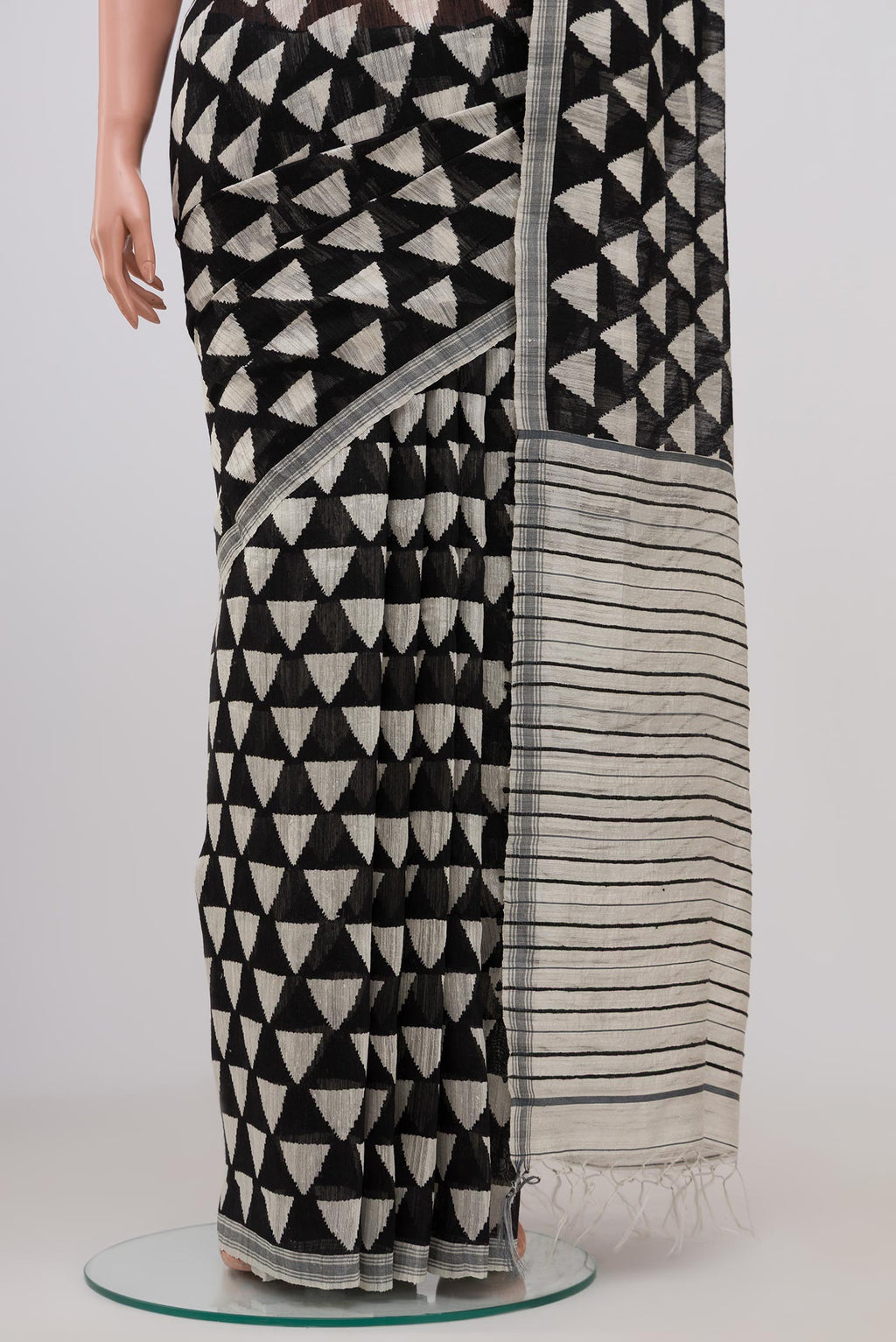Pleats and pallu of Black Tussar Silk Saree with Fancy on the body and Plain Border. 