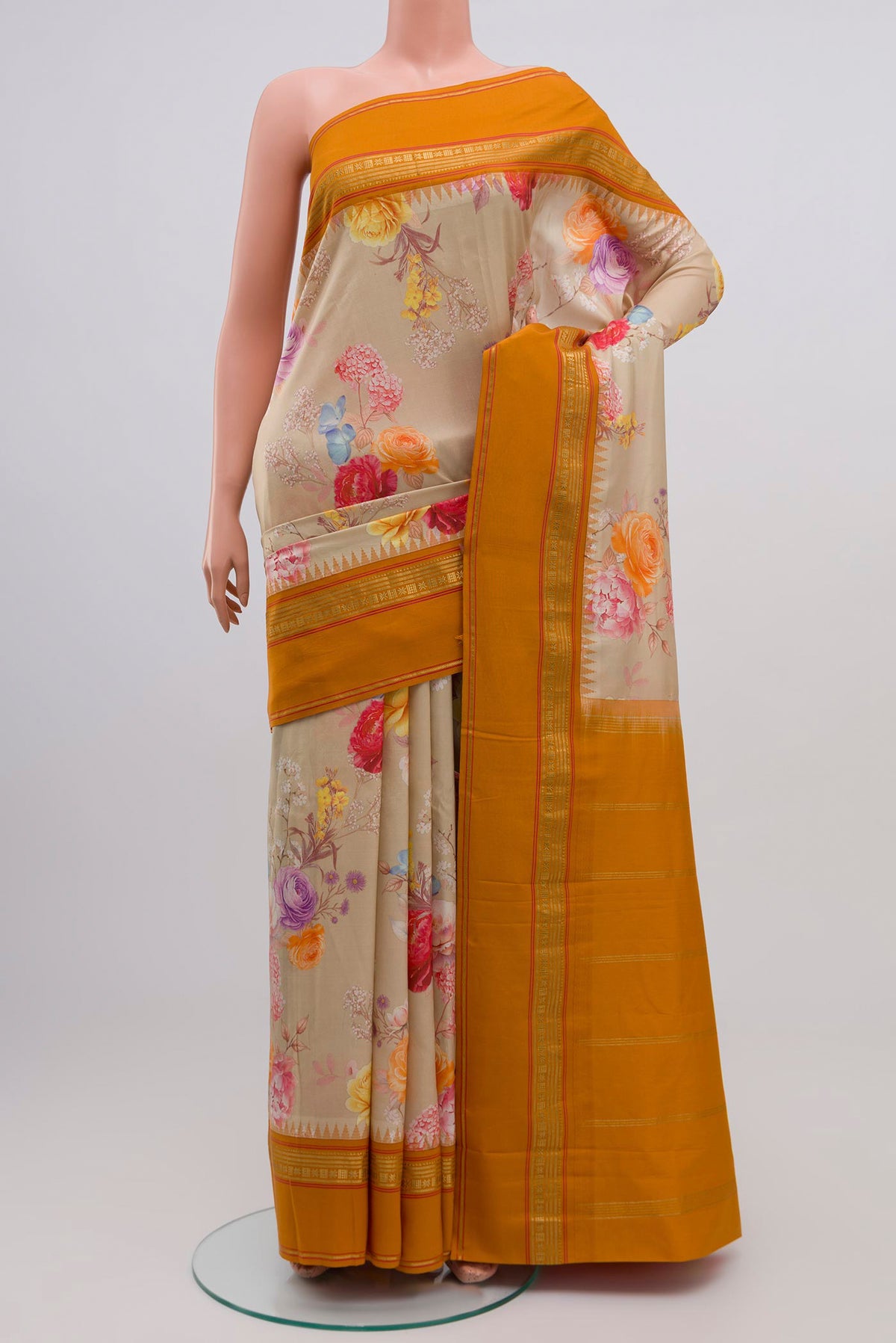 Beige Printed Silk Saree with Printed design on the body and Zari Border.  displayed on a mannequin