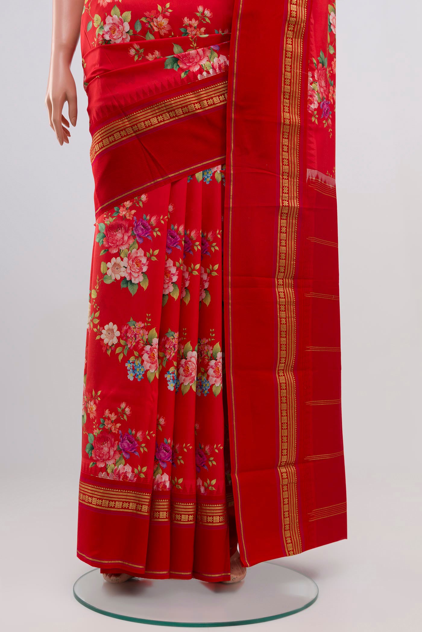 Pleats and pallu of Red Printed Silk Saree with Printed design on the body and Zari Border. 