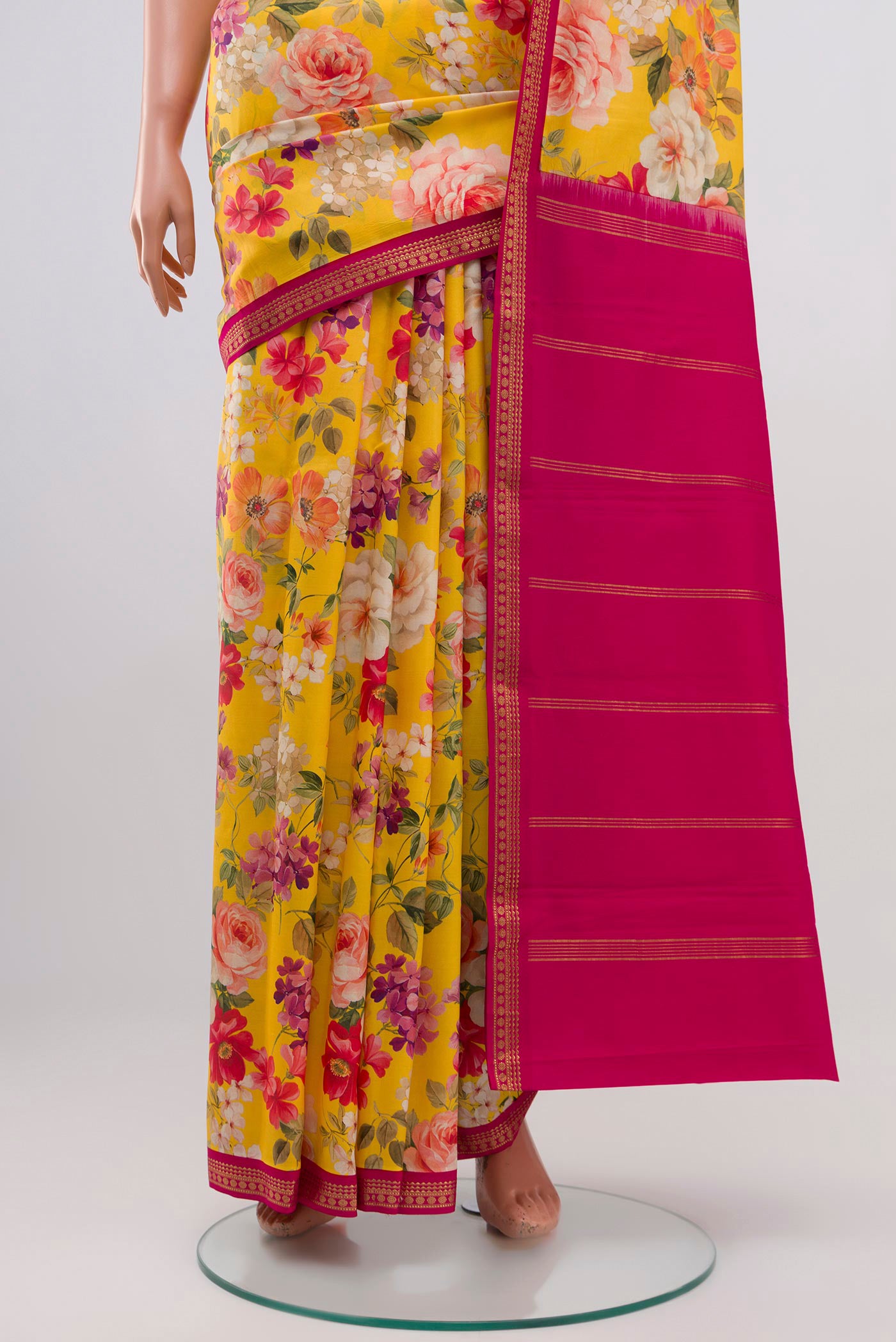 Pleats and pallu of Yellow Printed Silk Saree with Fancy on the body and Zari Border. 